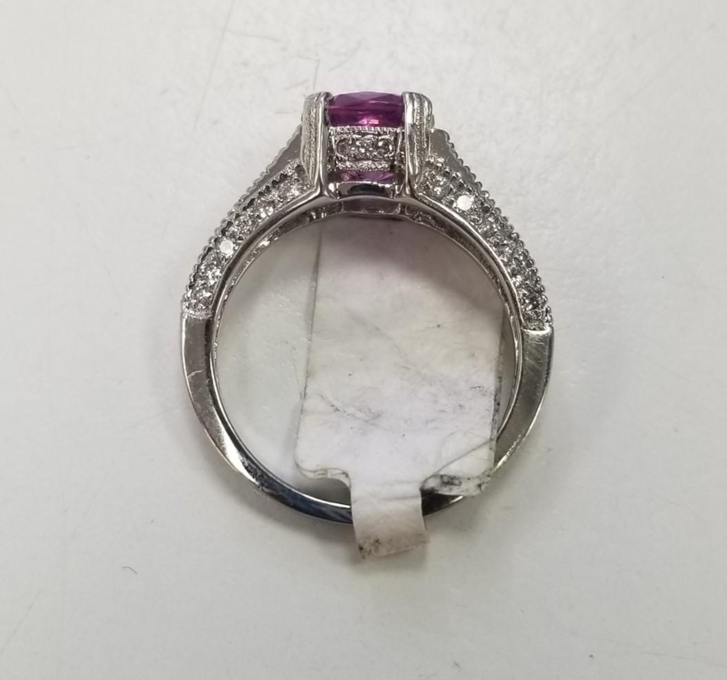 Contemporary Platinum Oval Pink Sapphire and Diamond Ring For Sale