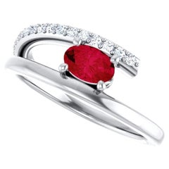 Platinum Oval Ruby and Accented Diamond Bypass Ring