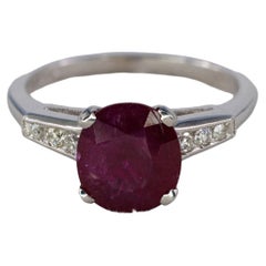 Platinum Oval Ruby Solitaire Ring with Diamond Accents