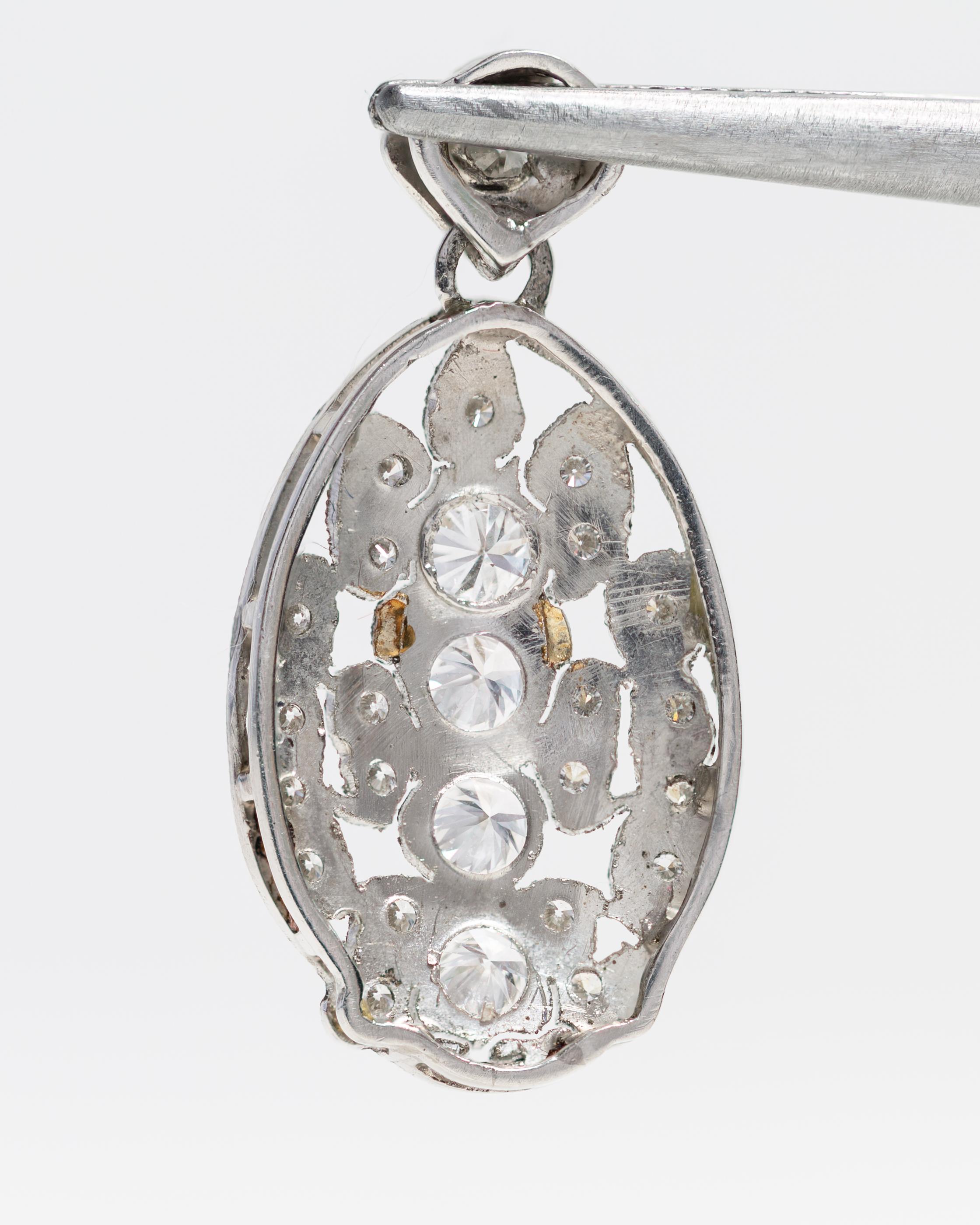 Round Cut Platinum Oval Shaped Pendant with Diamonds For Sale