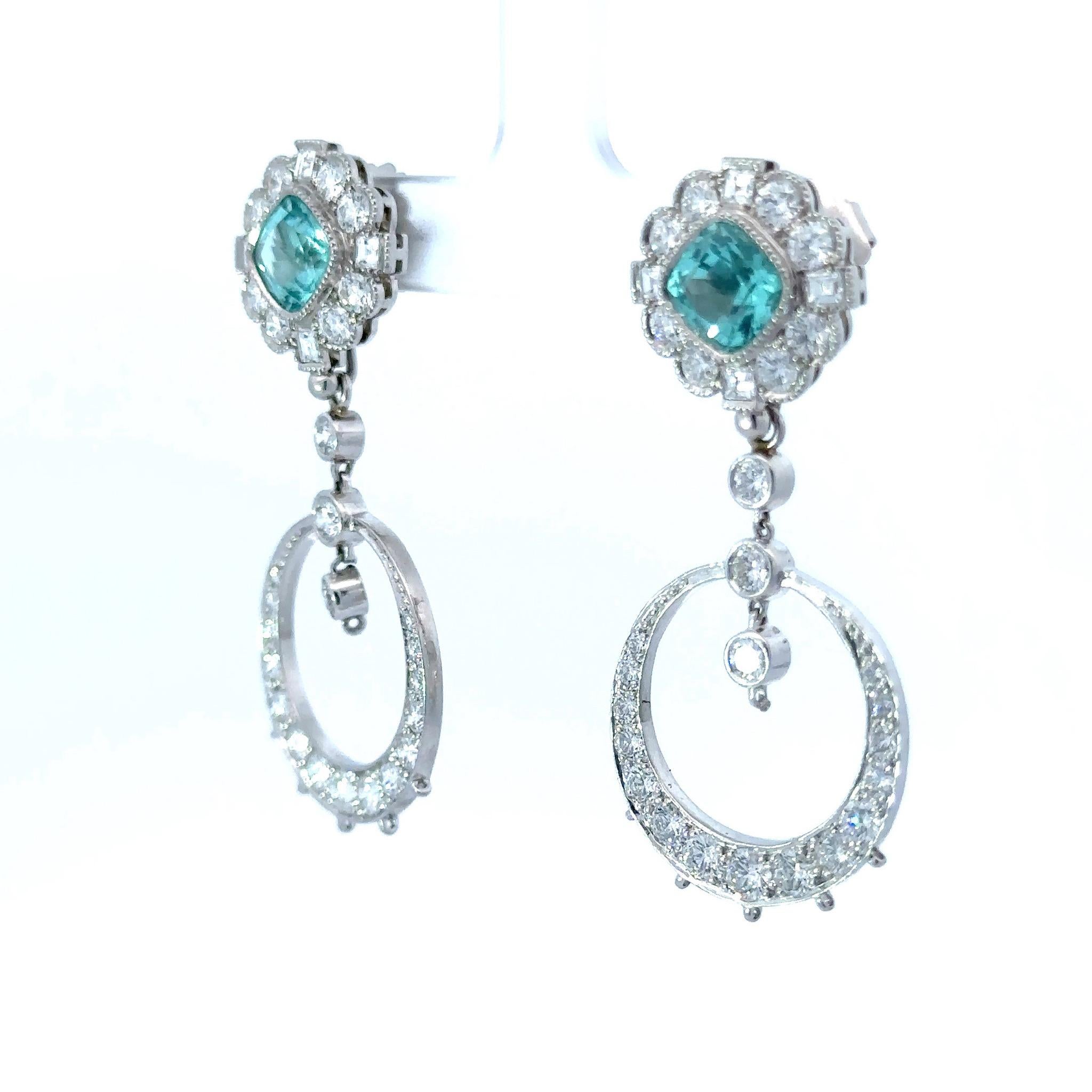 These stunning Paraiba & Diamond earrings set in Platinum are not only rare - the design and meticulous craftsmanship makes them one of a kind. When desired, the earrings can be an extravagant and glamorous pair of dangle earrings with a diamond