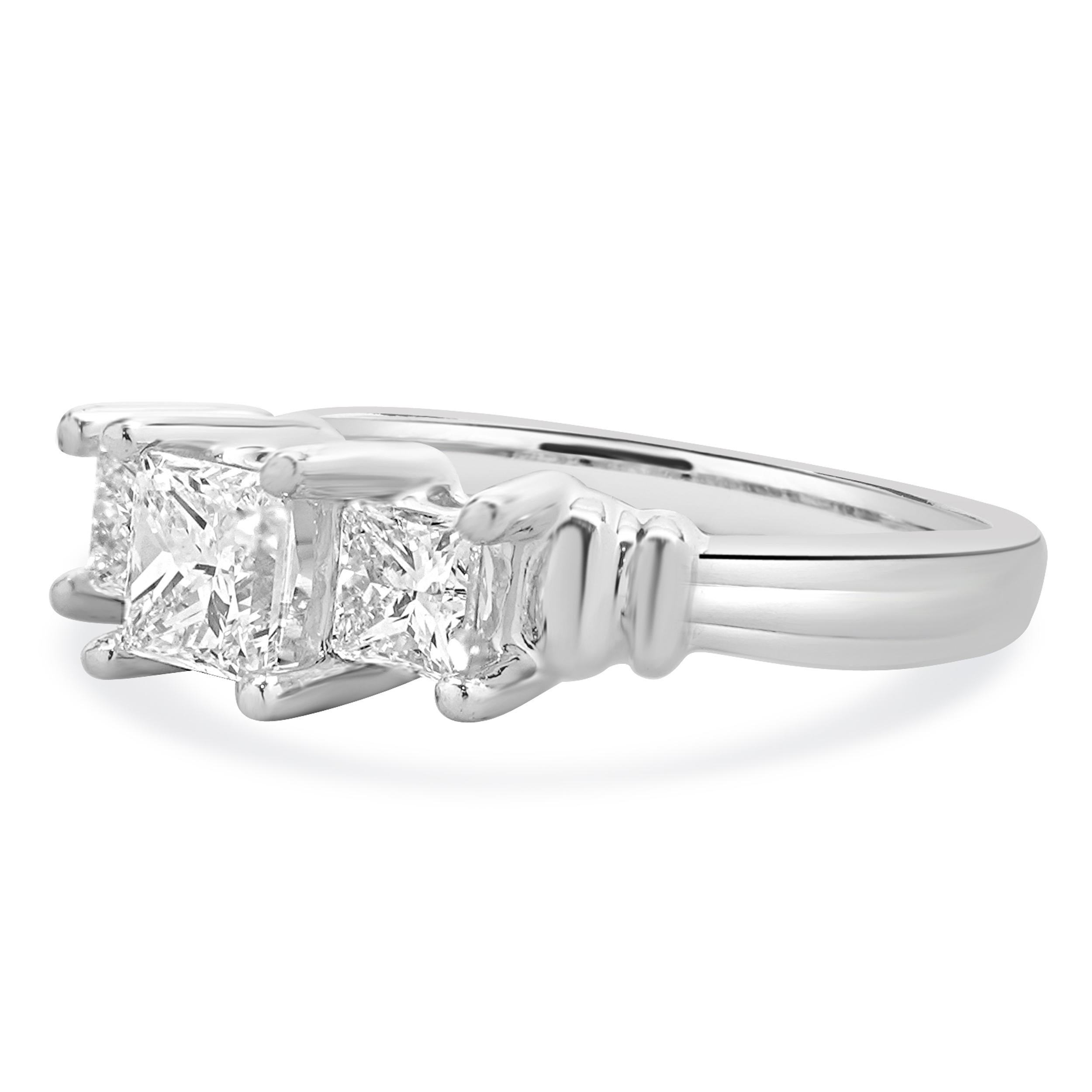 Material: Platinum
Center Diamond: 1 princess cut = 0.70ct
Color: H
Clarity: VS2
Diamond: 2 princess cut = 0.65cttw
Color: H
Clarity: SI1
Ring Size: 7 (please allow up to 2 additional business days for sizing requests)
Dimensions: ring measures