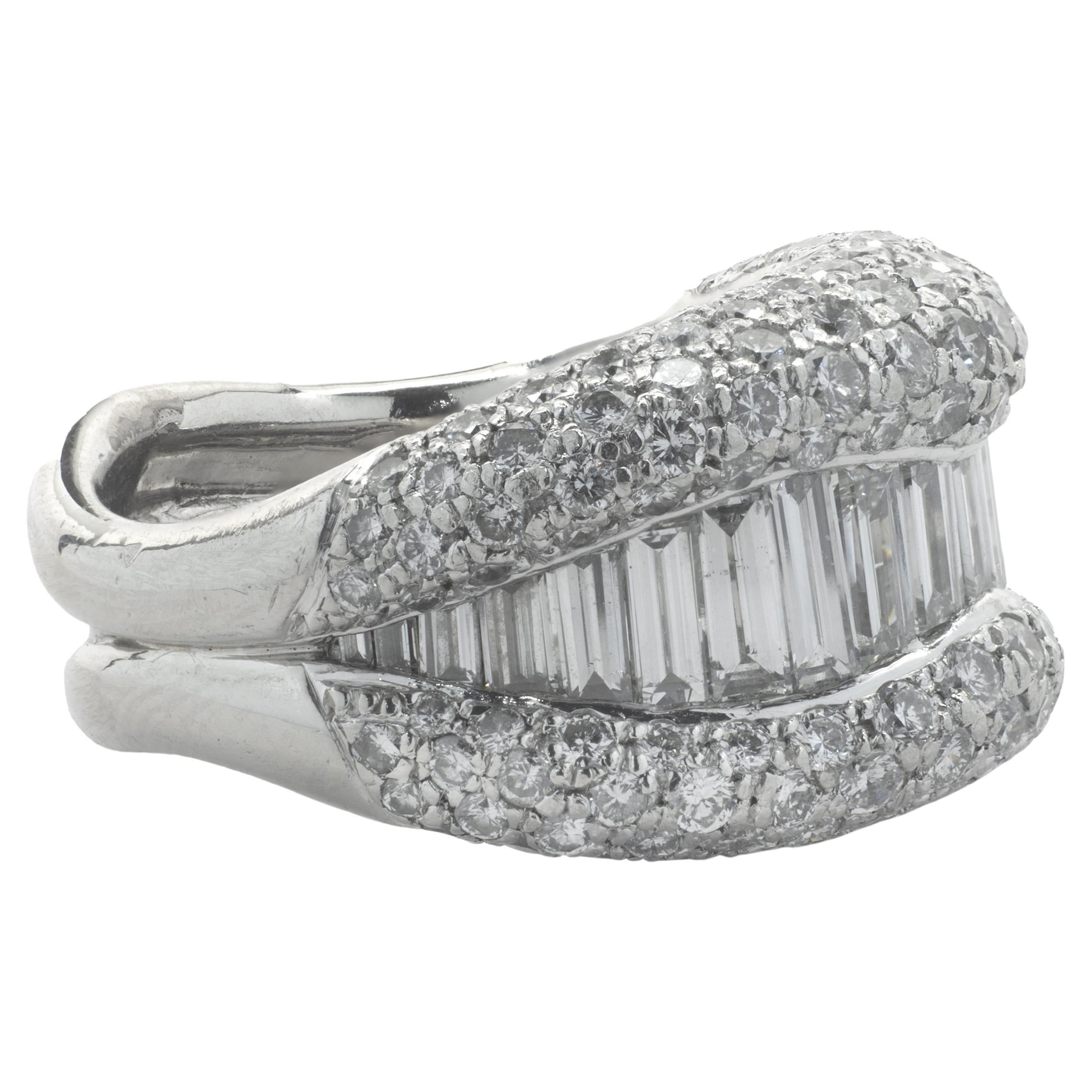 Designer: custom
Material: platinum
Diamond: 168 round brilliant cut = 2.52cttw
Color: G
Clarity: VS2
Diamond: 20 baguette cut = 1.06cttw
Color: G
Clarity: VS2
Ring size: 5.5 (please allow two additional shipping days for sizing requests)
Weight: 