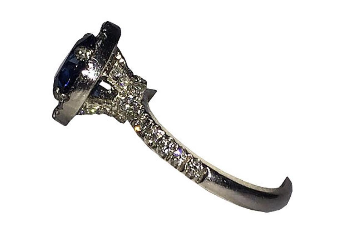 Contemporary Platinum Pavé Diamond and Blue Sapphire Ring For Sale