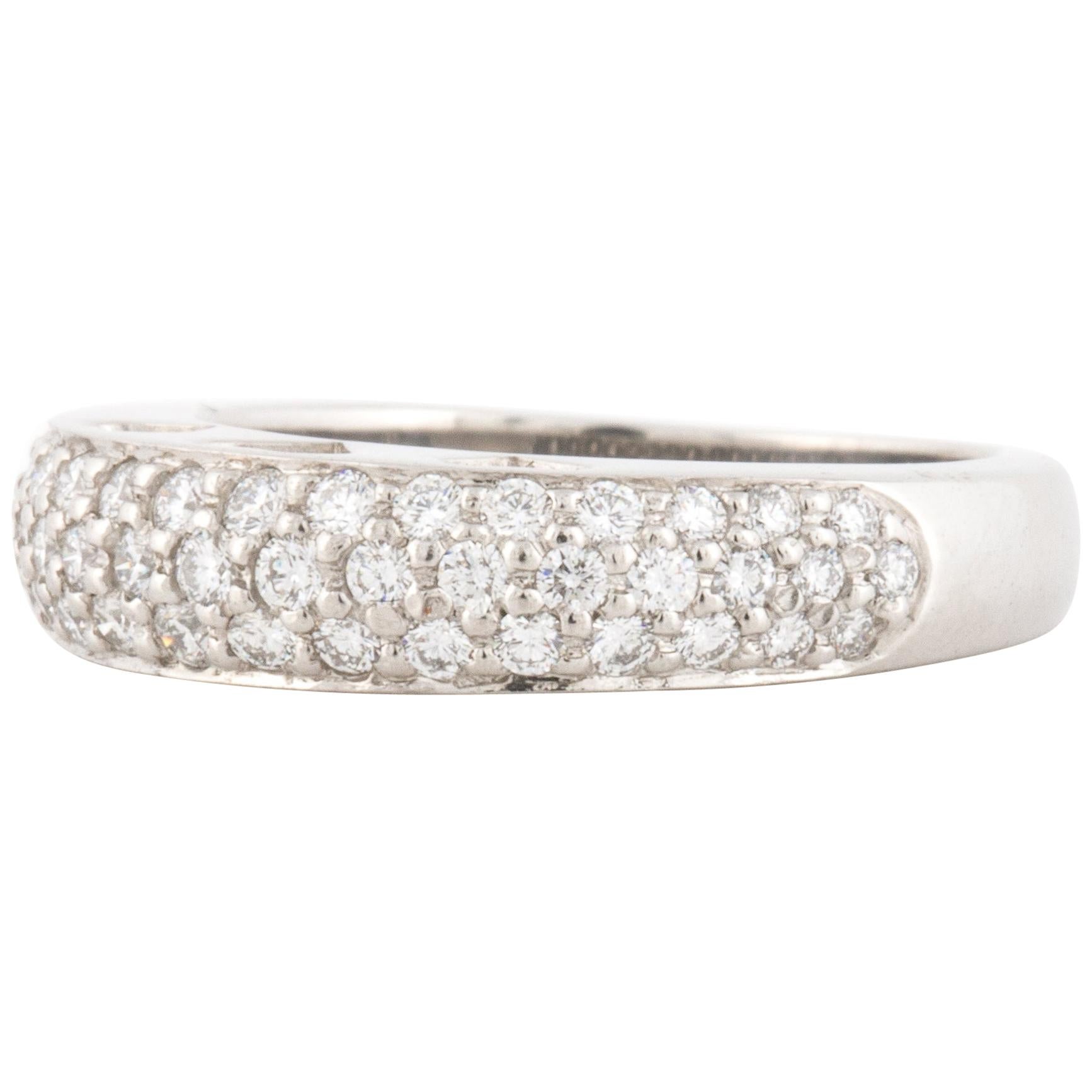 Platinum band with pavé round diamonds sitting atop the crown with open hearts on the sides.  There are three rows of diamonds which contain 49 round diamonds that total 0.70 carats, E-F color and VS clarity.  Measures 3/4 inches x 3/16 inches and