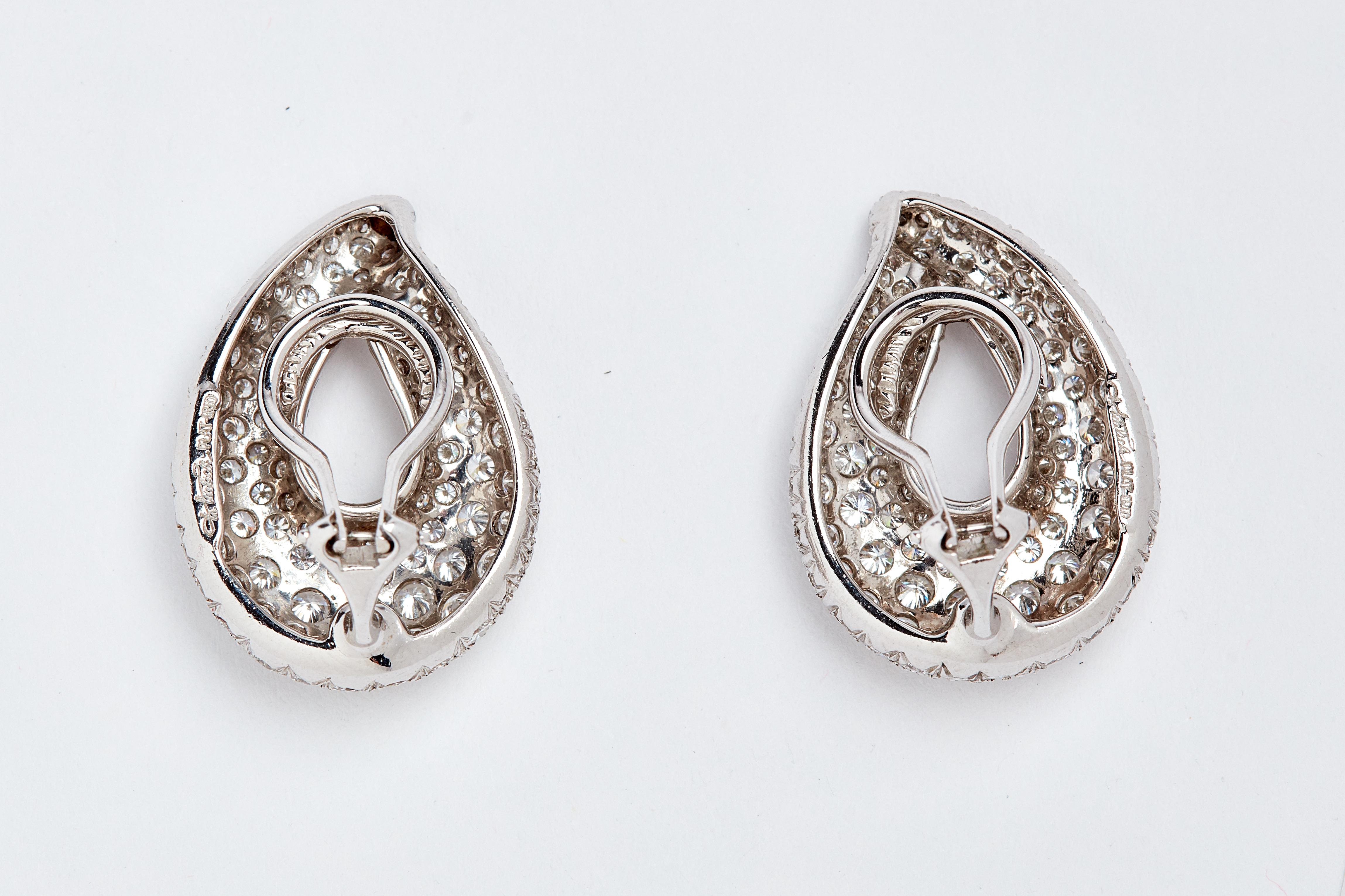 Platinum Pave Ear Clips. 260 white round diamonds. Aprox 7.50 carats total. 1 inch long. 