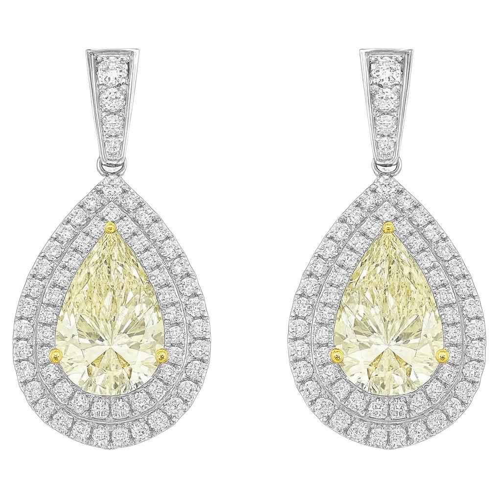 Orecchini a goccia in platino con pera e diamante rotondo in vendita