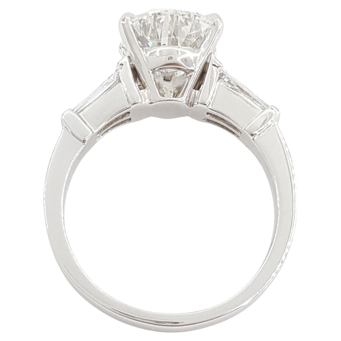Pear Cut Platinum Pear Brilliant Shaped & Tapered Baguette Cut Diamond Engagement Ring For Sale