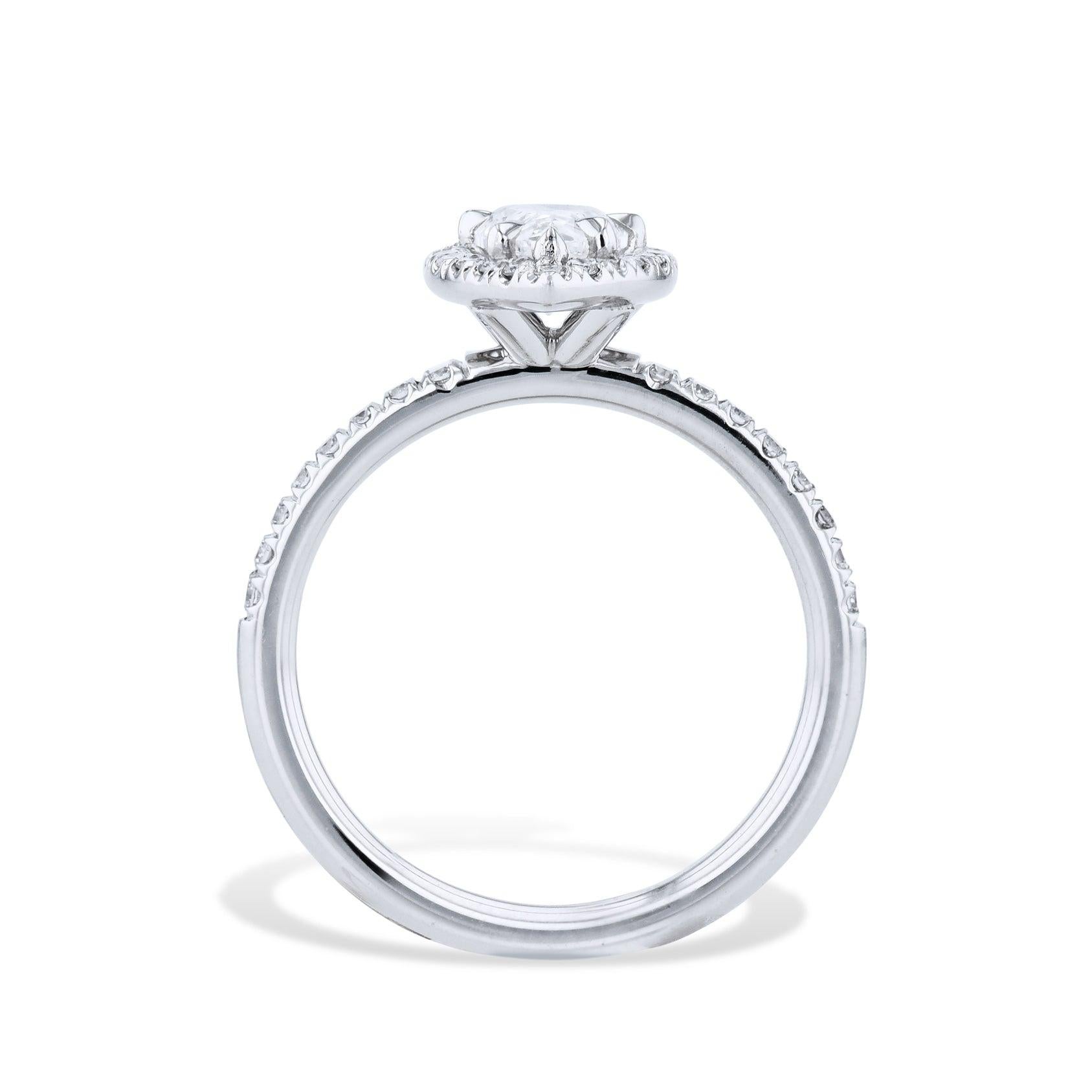 Experience sheer luxury with this Platinum Pear Shaped Diamond Engagement Ring!  Center stone is surrounded by a shimmering pave diamond halo and pave down shank. Handcrafted to perfection by H&H Jewels. Treat yourself to an unforgettable symbol of