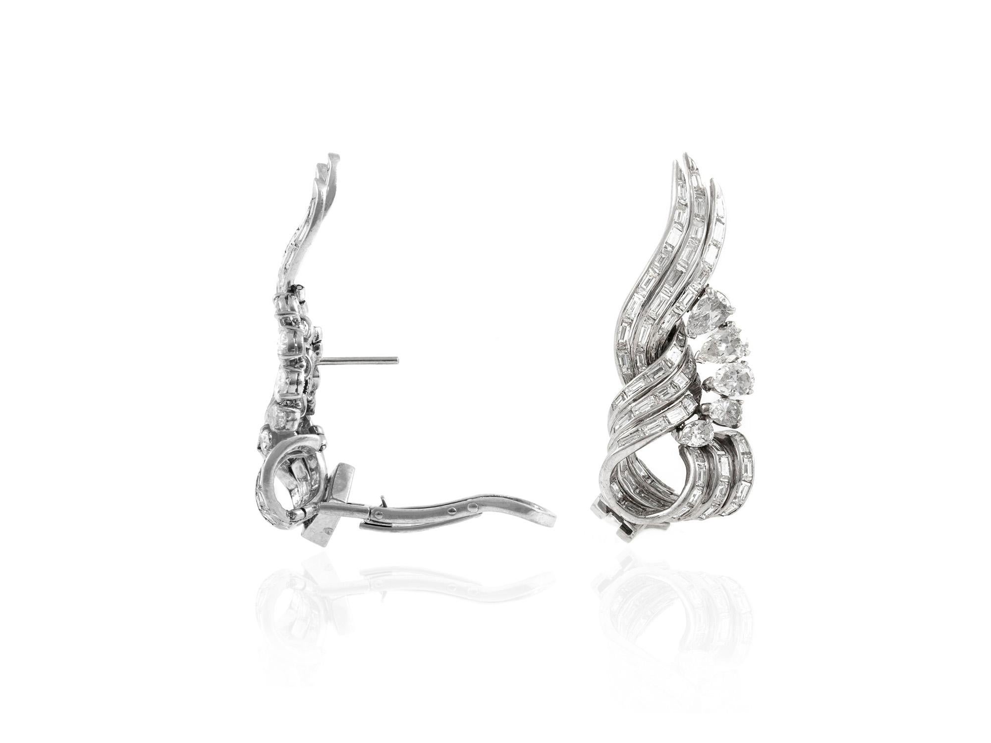 The earrings are finely crafted in platinum with diamonds in different cut weighing approximately total of 15.00 carat.
two ways to wear this earrings: possible to remove the drop part .
