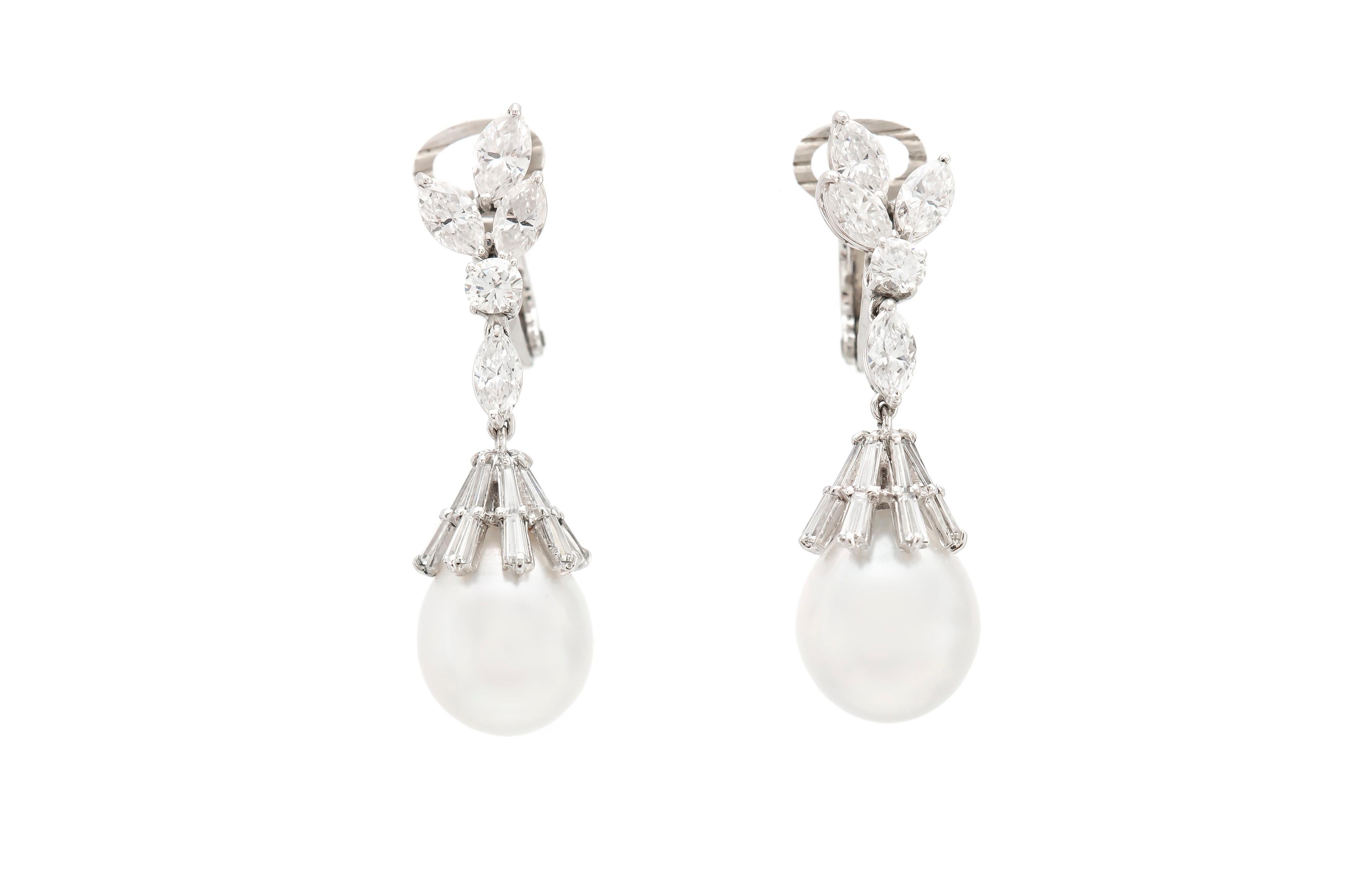 The earrings are finely crafted in platinum with two beautiful pearls and diamonds weighing approximately total of 4.00 carat.