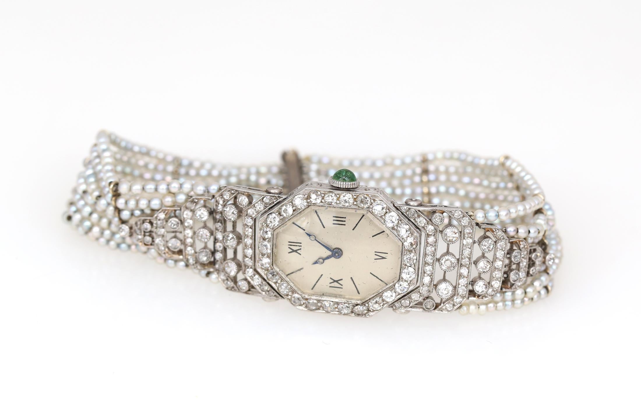 Platinum and Pearls with Emerald Enamel and Diamonds Ladies Watch. Delicate and beautiful Platinum Vintage watch with a big Enamel dial for its time. 1930. Emerald Сabochon installed in the head. Natural pearls and Diamonds create the magical