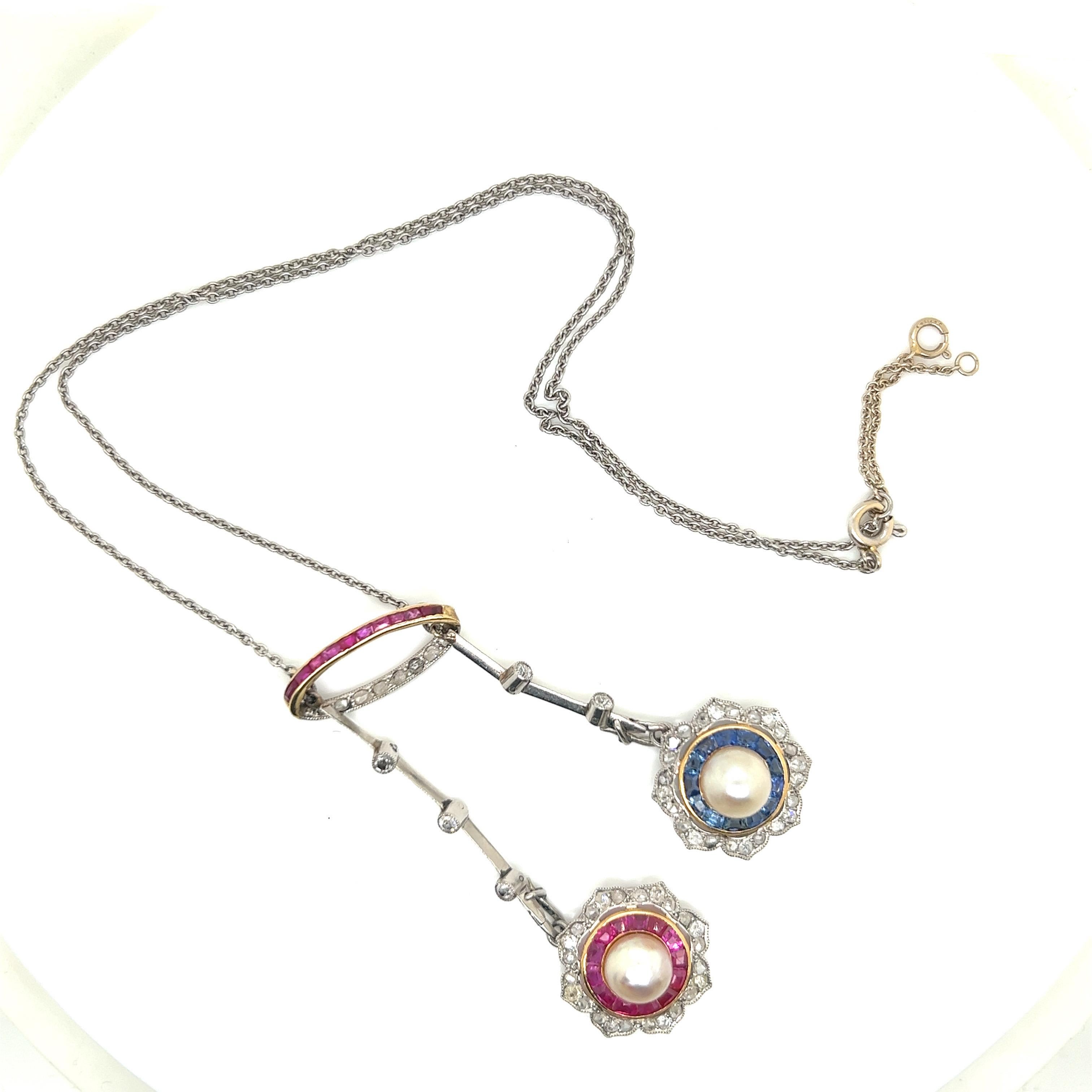 Belle Époque Platinum Pearls Ruby, Sapphire and Diamond Pendant Necklace For Sale