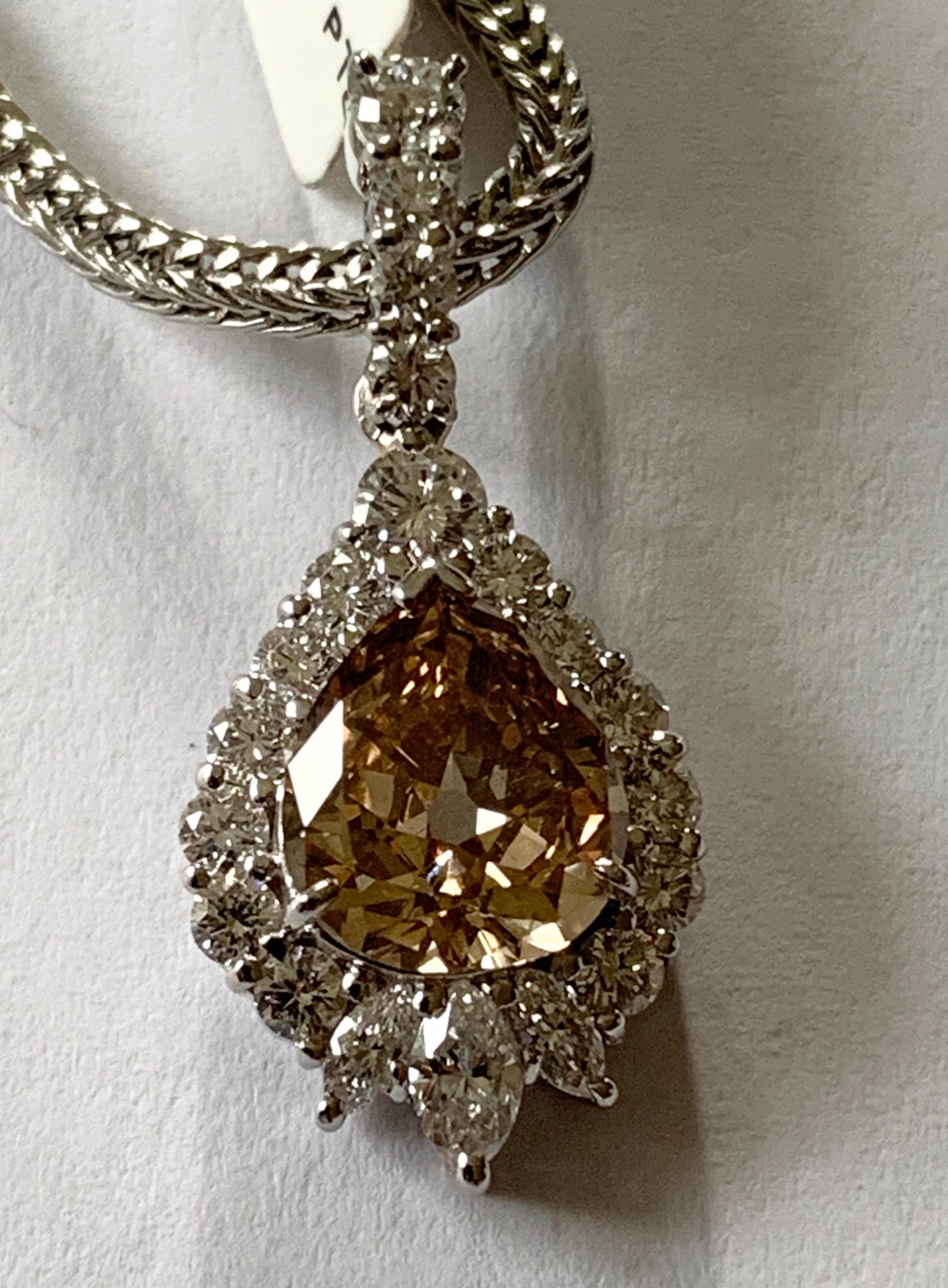 Women's or Men's Platinum Pendant with Chain Set with a Pear Shape Champagne Diamond For Sale