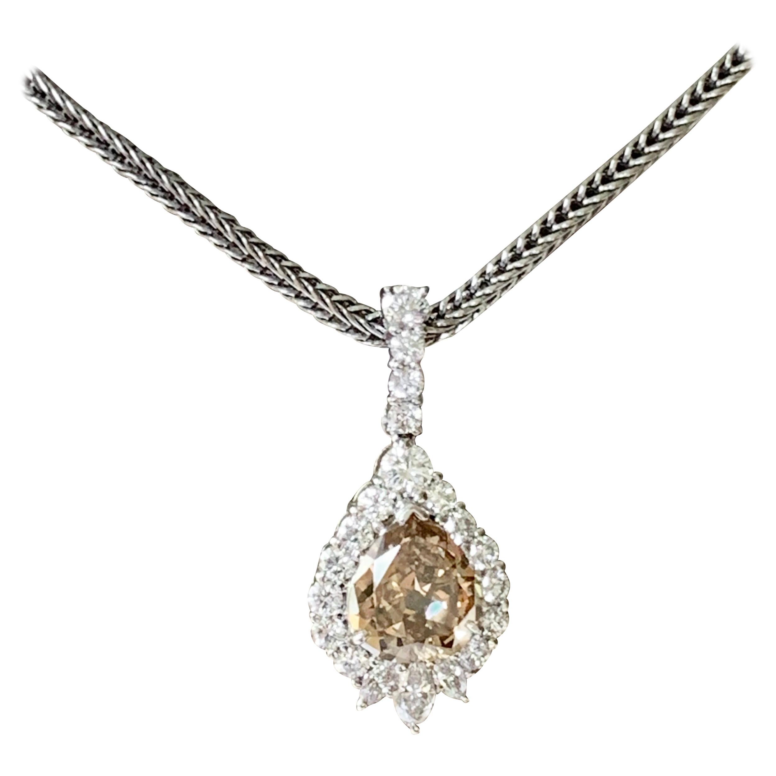 Platinum Pendant with Chain Set with a Pear Shape Champagne Diamond For Sale