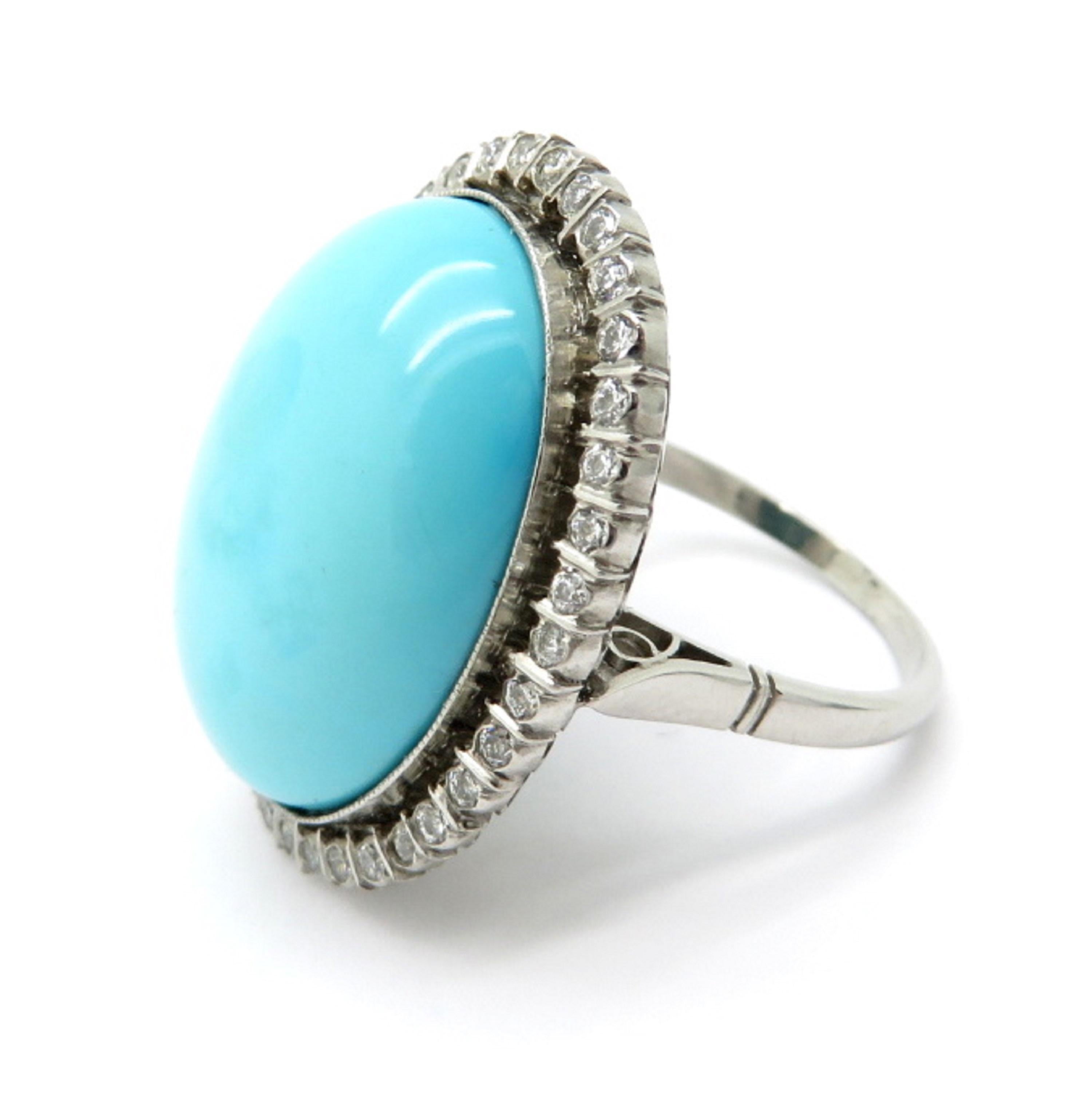 Platinum Persian turquoise and diamond halo fashion ring. Centering one fine quality oval Persian turquoise cabochon weighing approximately 14.90 carats. Accented with 37 Old European cut bar set diamonds weighing a combined total of 0.45 carats.