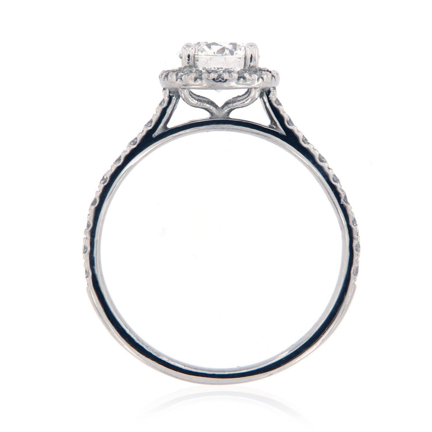 This Petite halo ring features perfectly matched brilliant round diamonds 1.3 mm each ( 1/4 Carat total weight)  Micro-Prong set on a 1.7 mm wide shank. In the center of the ring is set one Ideal cut GIA Certified diamond.
Shape: Round
Color: