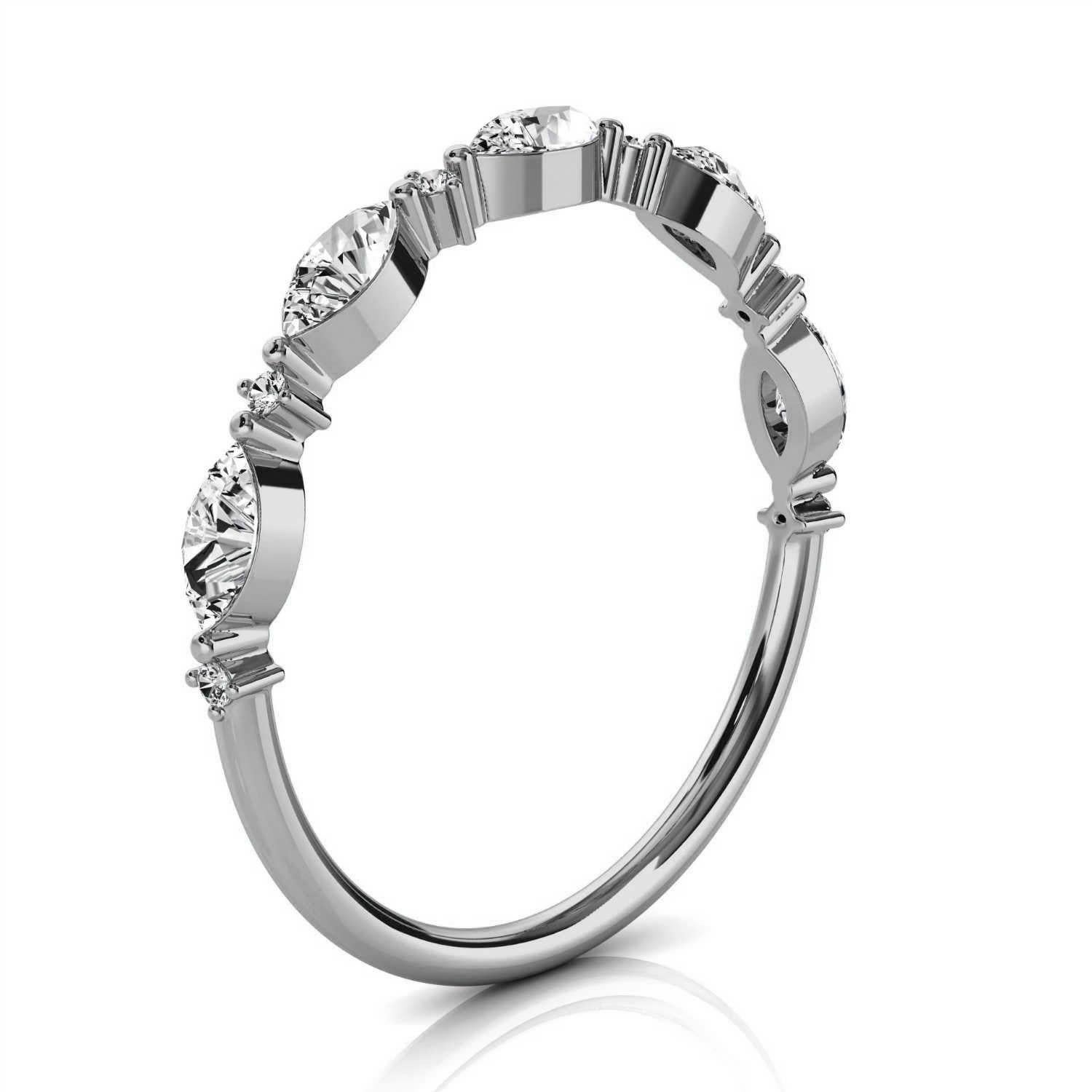 This delicate ring features five (5) marquise shape diamonds prong-set alternating with six (6) round brilliant diamonds set in a tiny three prongs, each on a 1.25 mm band. It's stackable; it's brilliant. You will love it! Experience the difference