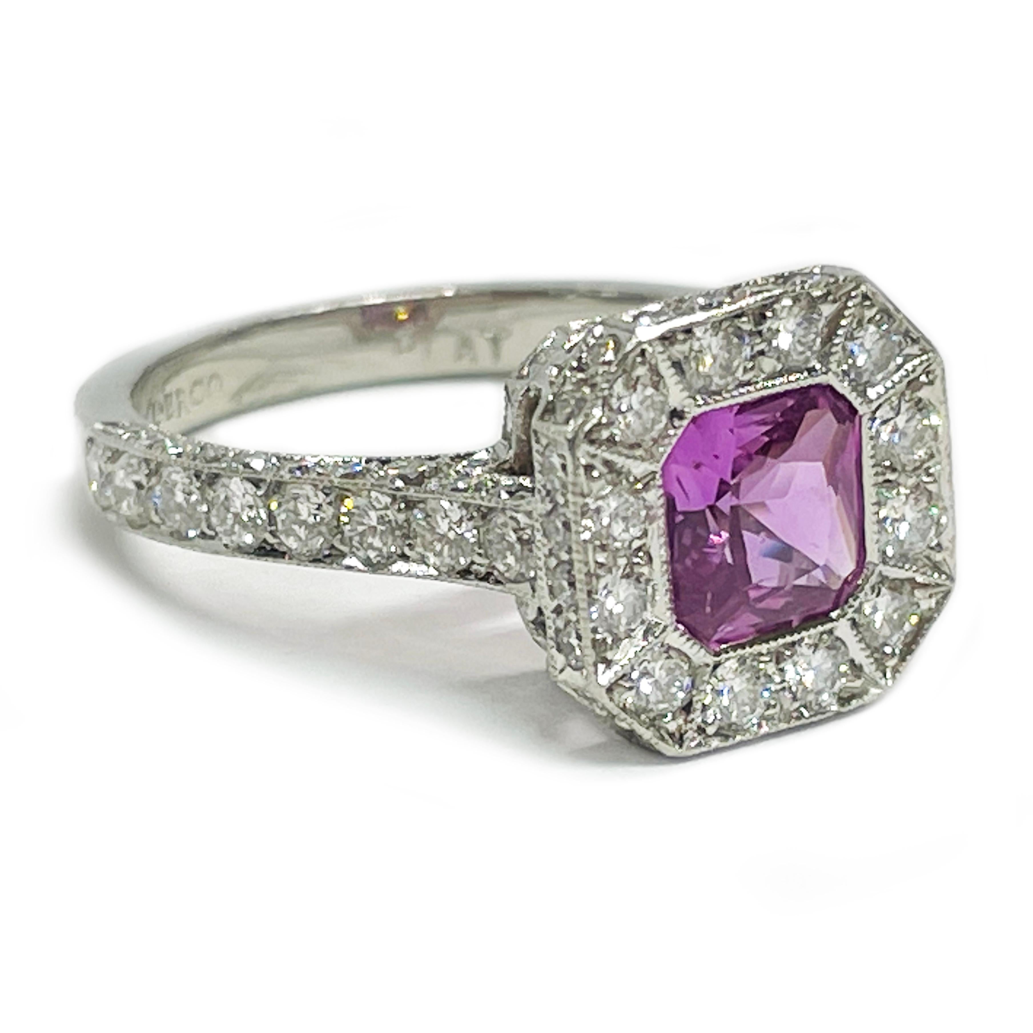 Platinum Pink Sapphire Diamond Ring. The ring features a princess-cut pink sapphire with a micro-melee design with diamonds set in the top and sides of the bezel and shank with milgrain detail. The bead-set round diamonds continue along the bottom