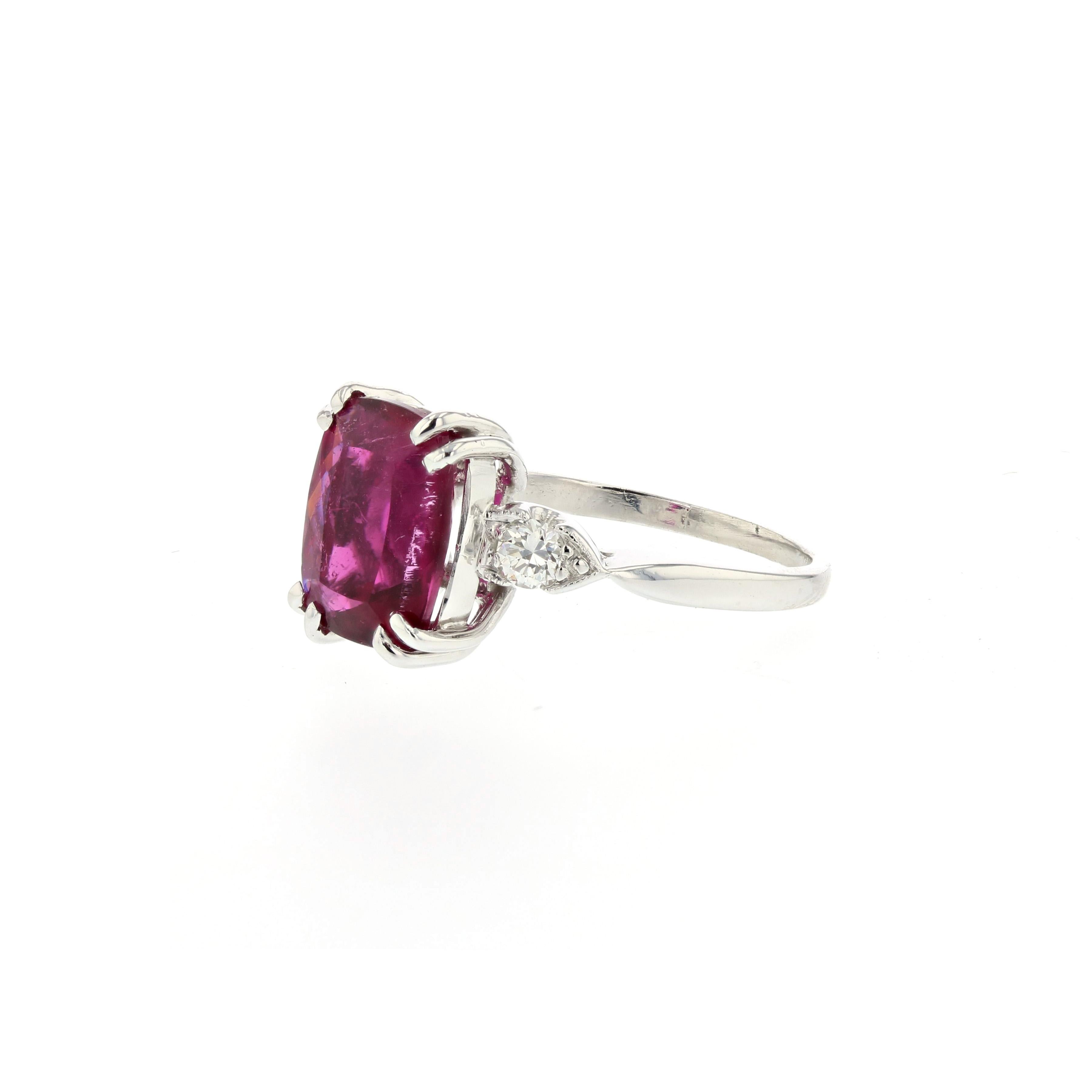 Platinum ring featuring a 3.02 carat pink tourmaline stone with two accent diamonds.  Presentation area measures 5/8 of an inch by 3/8 of an inch.   Size 6 and may be sized.