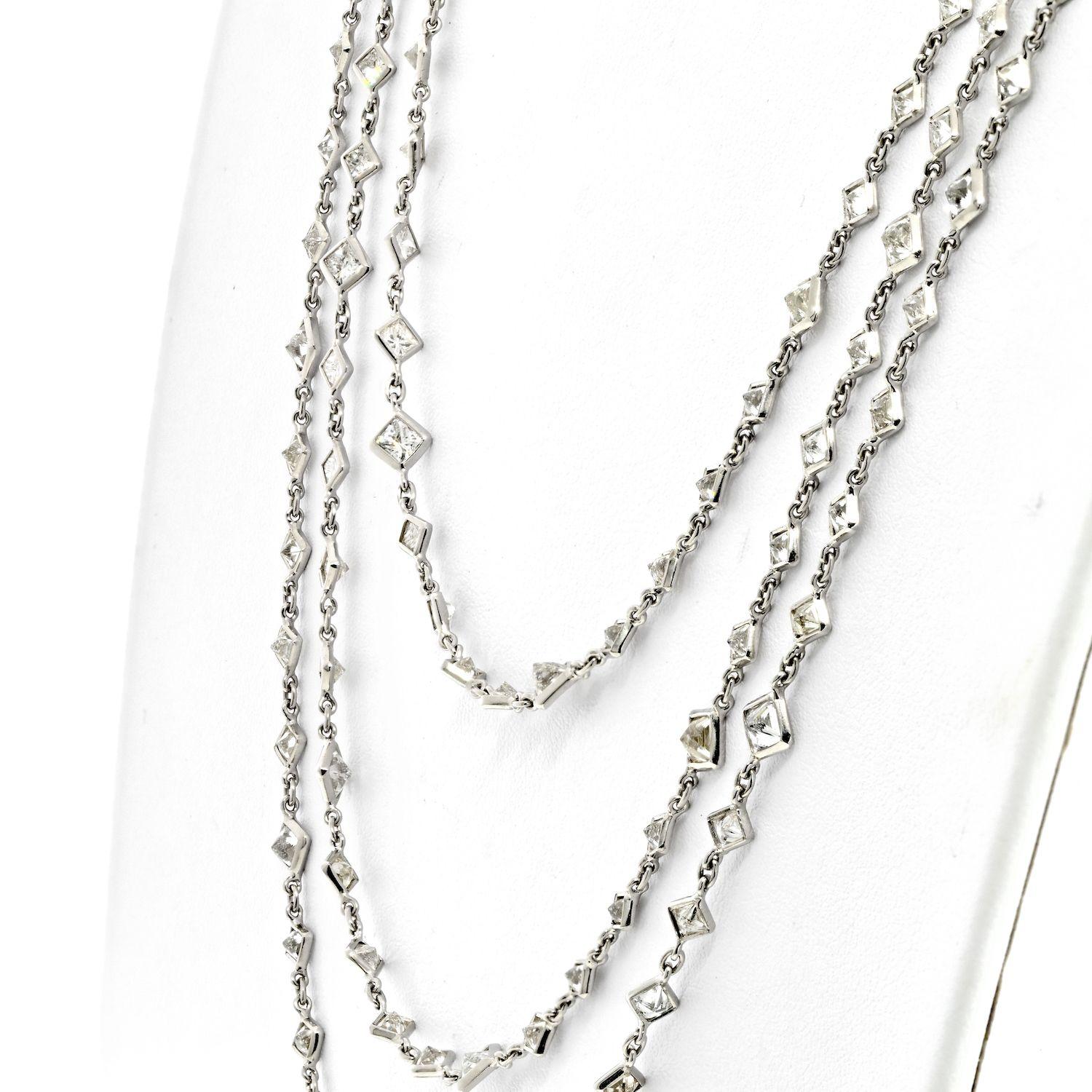 The Diamond by the Yard Chain Necklace in platinum is a luxurious and impressive piece of jewelry. Measuring 76 inches in length, this necklace is adorned with 234 princess cut diamonds, each mounted cleanly and exhibiting a colorless quality that