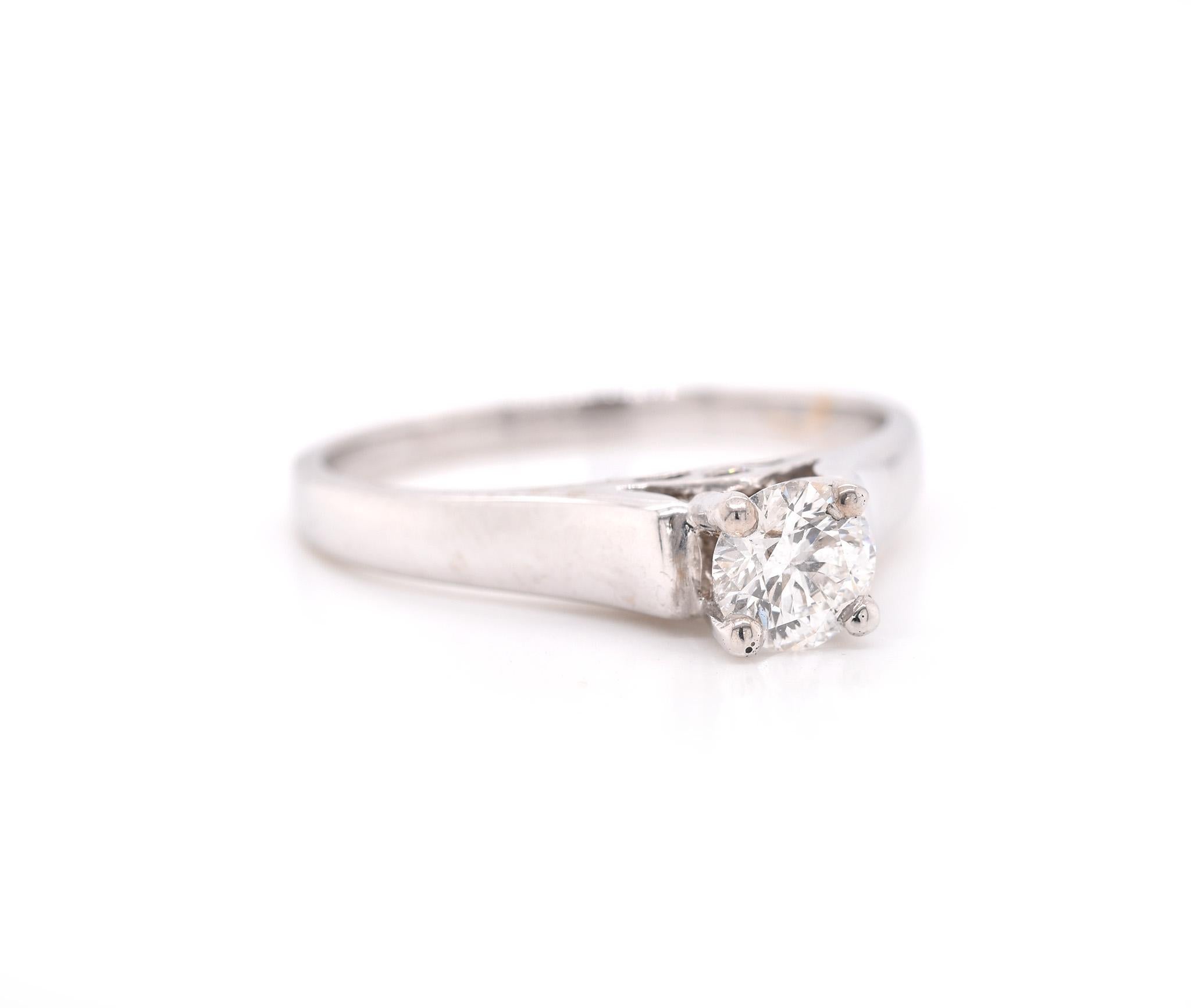 Designer: custom
Material: 14k white gold
Center Diamond: 1 round modified brilliant = 0.50ct
Color: F-G
Clarity: SI1
Size: 8 ½  (please allow two additional shipping days for sizing requests)  
Dimensions: ring top is approximately 5.18mm by