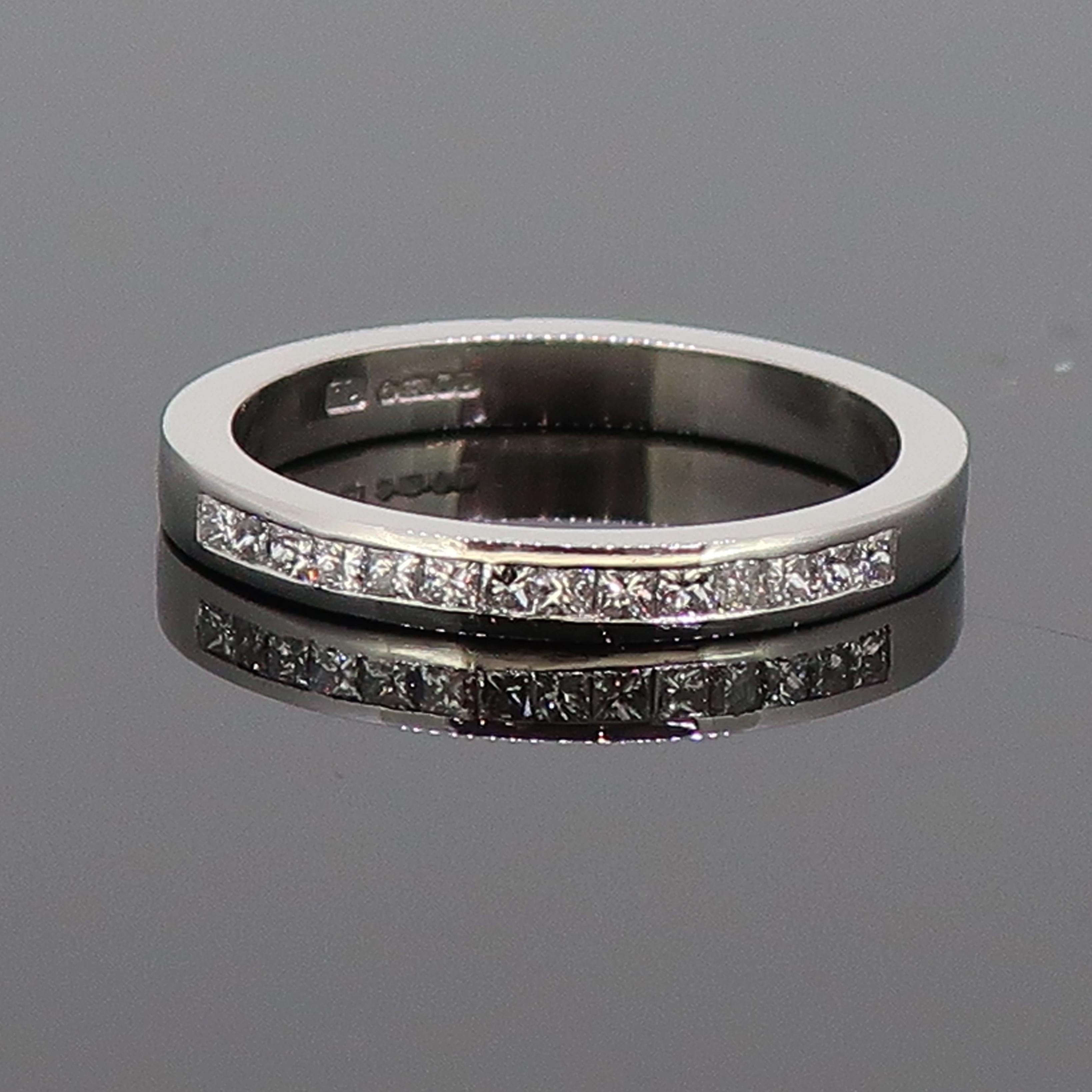 Platinum Princess Cut Diamond Eternity Band Ring

A delicate and dainty diamond eternity ring. The ring consists of fourteen small princess cut diamonds in a channel setting. Very low profile and sits flat on the finger. It would be a great stacking