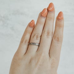 Fede nuziale in platino con diamante taglio principessa