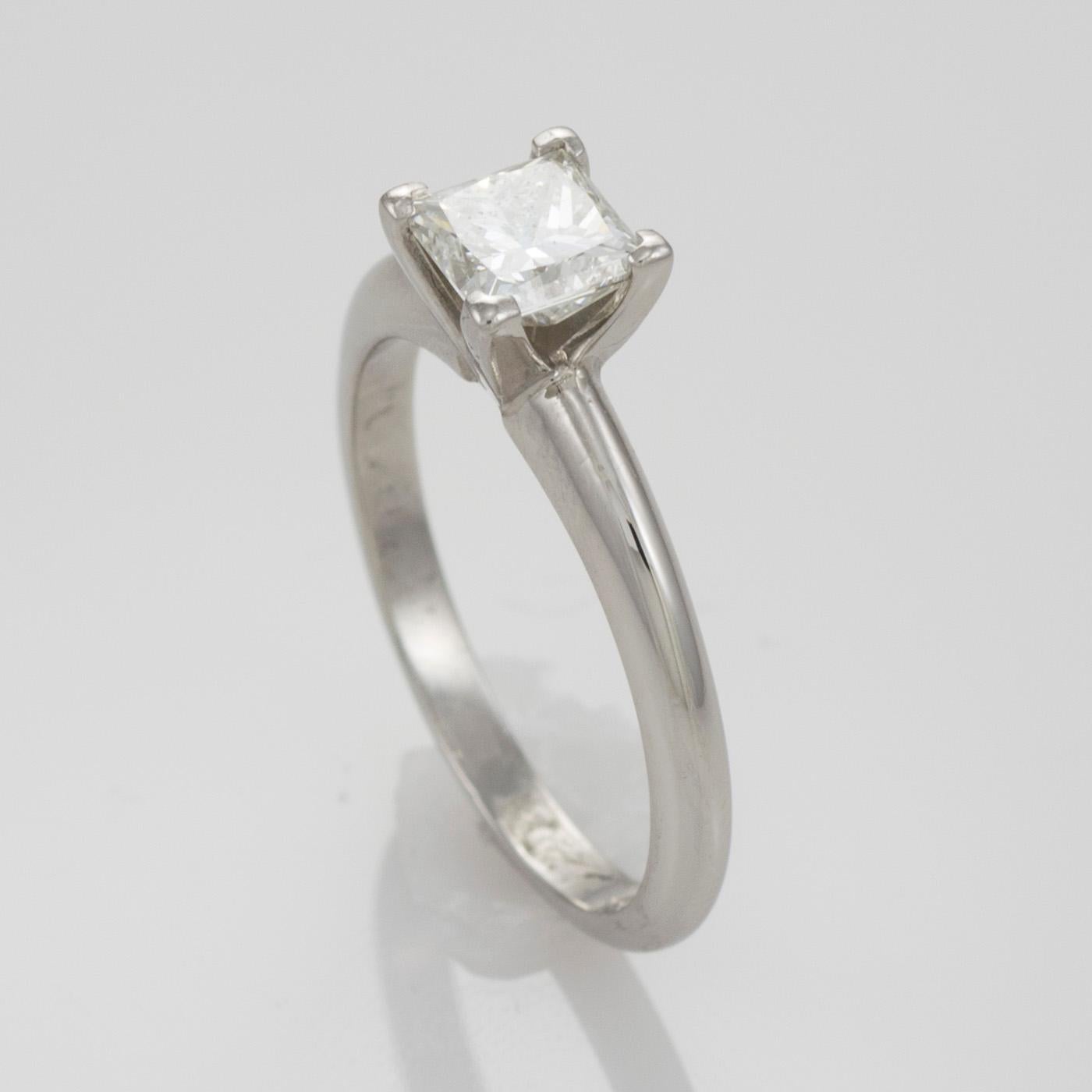 Ladies Platinum ring with princess cut diamond.

Stamped .950 Pt and weighs 4.3 grams.

The diamonds is a square modified brilliant cut, .74 carat, I color, VS1 clarity.

The diamond is laser inscribed with the GIA certification number 15484606 on