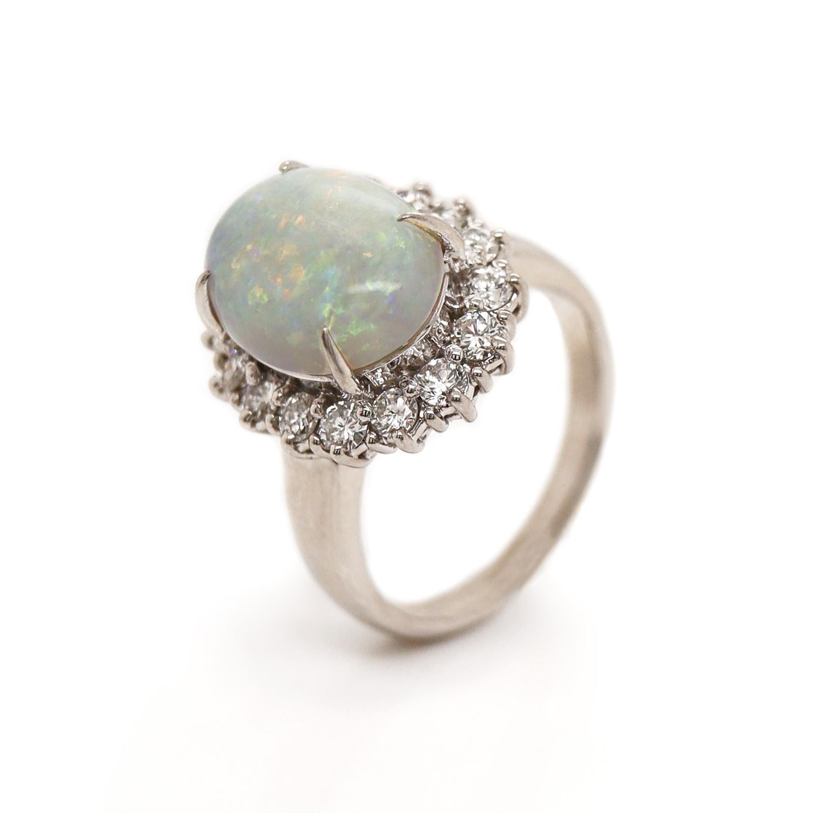 Platinum Australian Opal And Diamond Dress Ring

This stunning dress ring features a beautifully opalescent centerpiece Australian Opal from Coober Pedy, renowned for its exceptional play of color. Showcases a mesmerizing range of colors, including