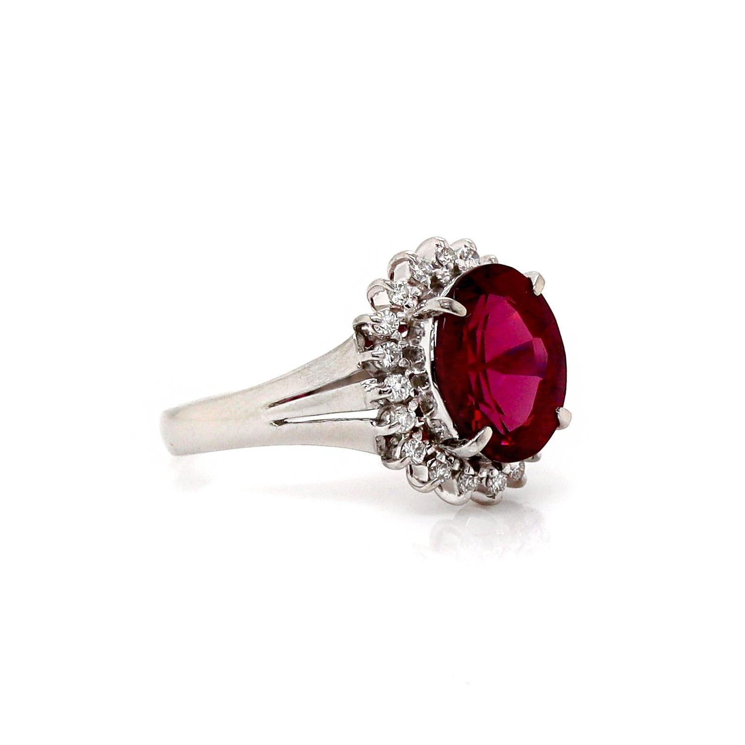 Platinum Pt900 Garnet And Diamond Dress Ring

This exquisite dress ring showcases a stunning oval cut Rhodolite Garnet in a captivating purplish red hue. Encircled by 20 round brilliant cut bright, icy sparkle and diamonds. The combination of the