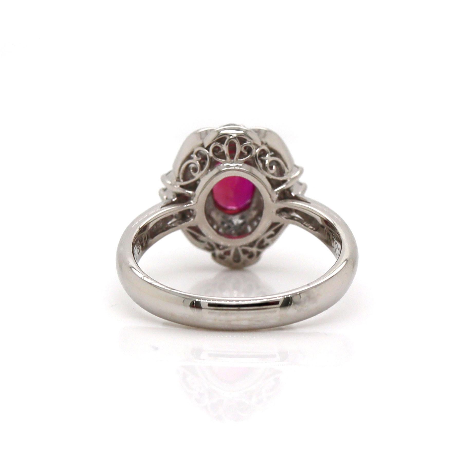 Platinum Pt900 Ruby & Diamond Ring

This exquisite platinum ring features a stunning oval ruby, the centerpiece of the design, elegantly surrounded by a sparkling halo of brilliant-cut diamonds. The rich, deep red of the ruby is both bold and