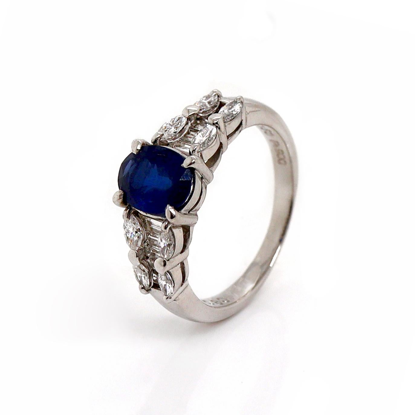 Platinum Pt900 Sapphire and diamond dress ring

This elegant platinum ring showcases a stunning 1.50ct blue sapphire at its heart, captivating with its deep, vibrant hue. The sapphire is perfectly complemented by marquise-cut diamonds on either