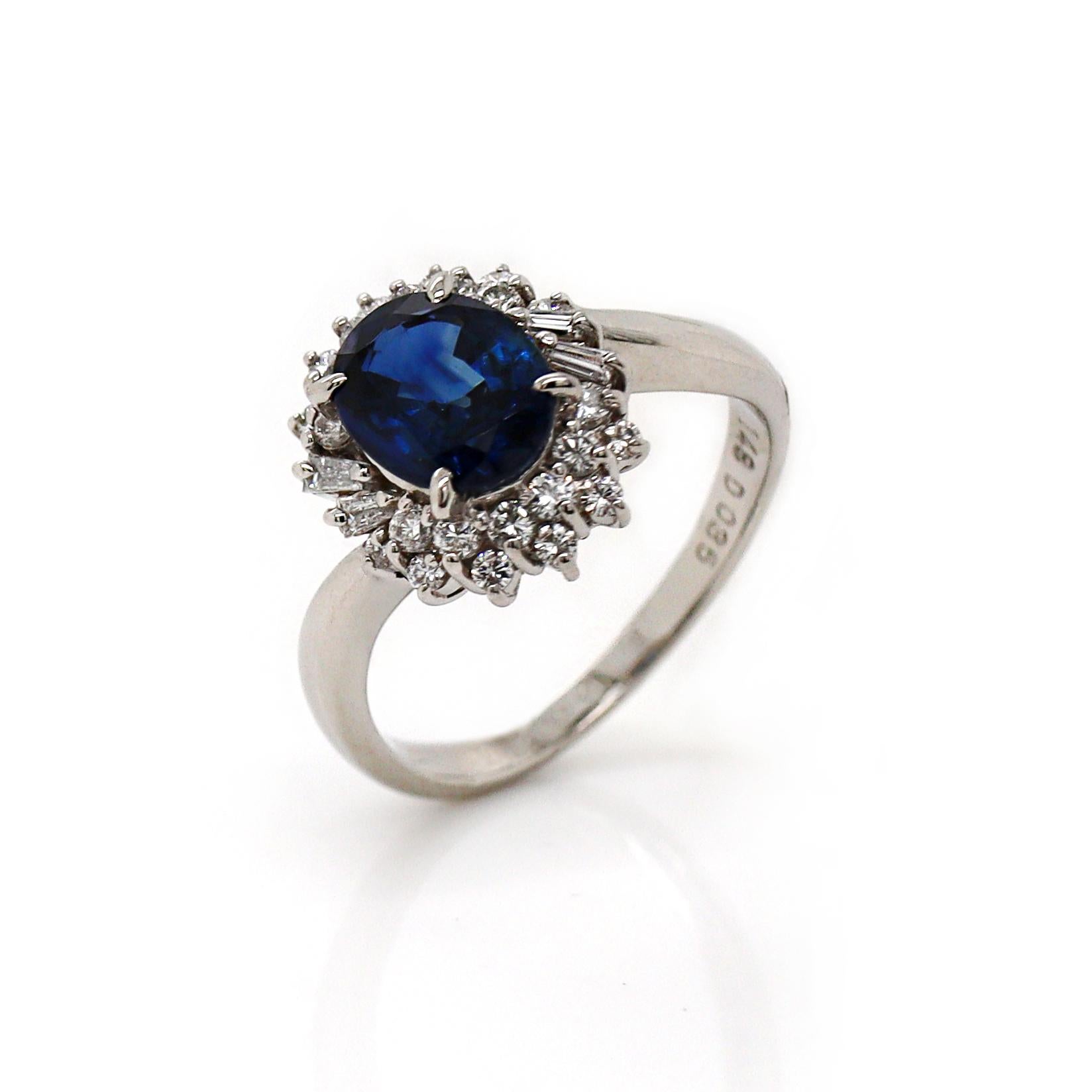 Platinum Pt900 Sapphire and Diamond Ring

This elegant platinum ring features a stunning 1.48-carat oval-cut blue sapphire as the centerpiece, its deep blue hue radiating with striking clarity and vibrance. The sapphire is gracefully flanked by a