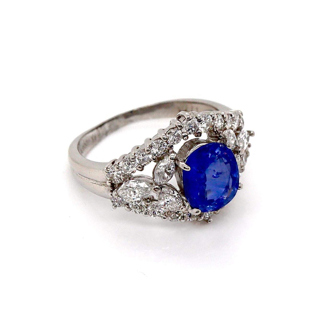 Platinum PT900 Sapphire and Diamond Ring

This exquisite platinum ring features a stunning cornflower blue sapphire, known for its rich, vibrant hue and fine clarity, at its center. The sapphire is elegantly flanked by two marquise-cut diamonds,