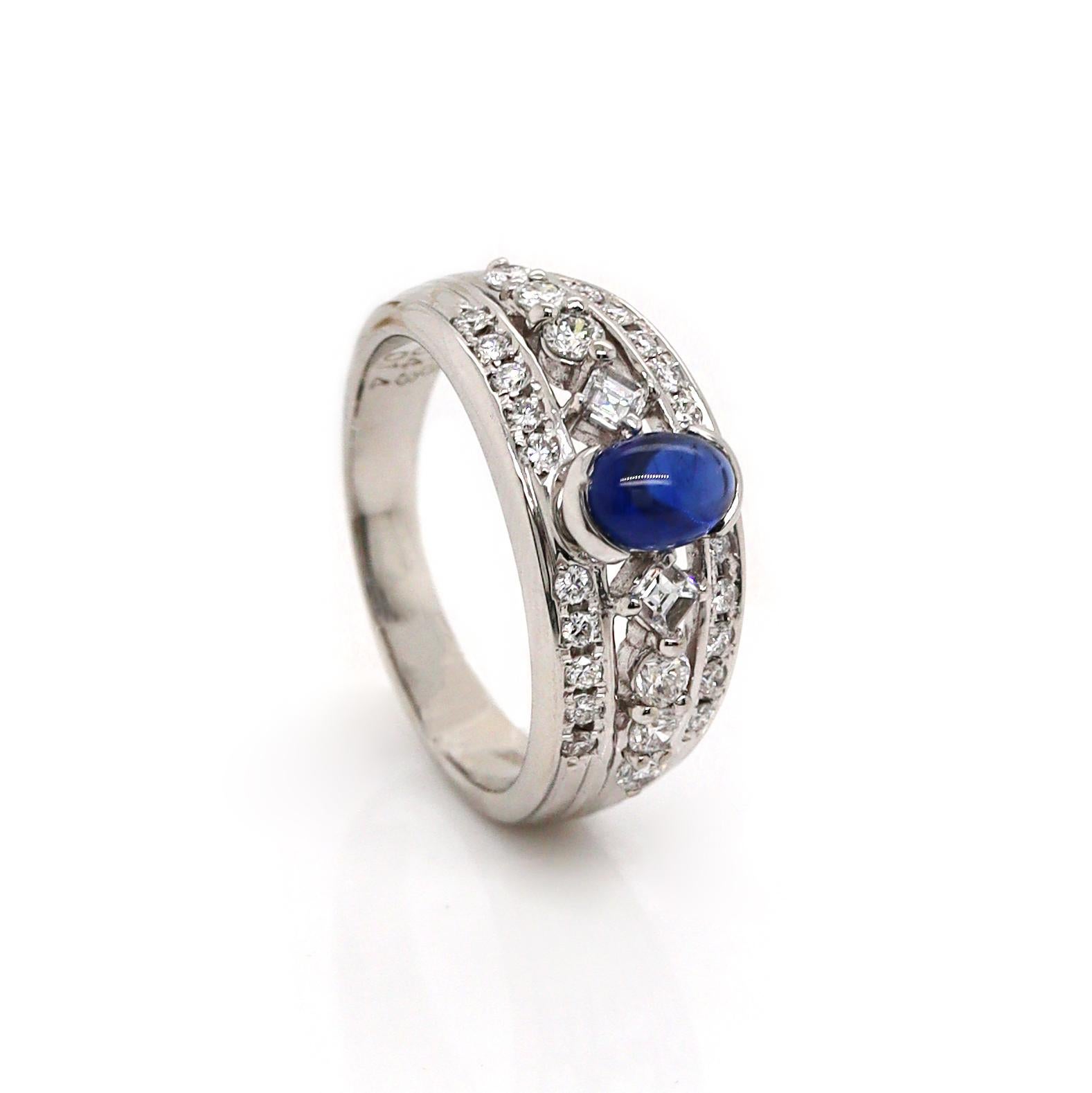 Platinum Pt900 Sapphire & Diamond Ring

This elegant platinum ring features a striking cabochon-cut blue sapphire at its center, its smooth, rounded surface showcasing the deep, velvety blue hue of the gemstone. The sapphire is beautifully framed by