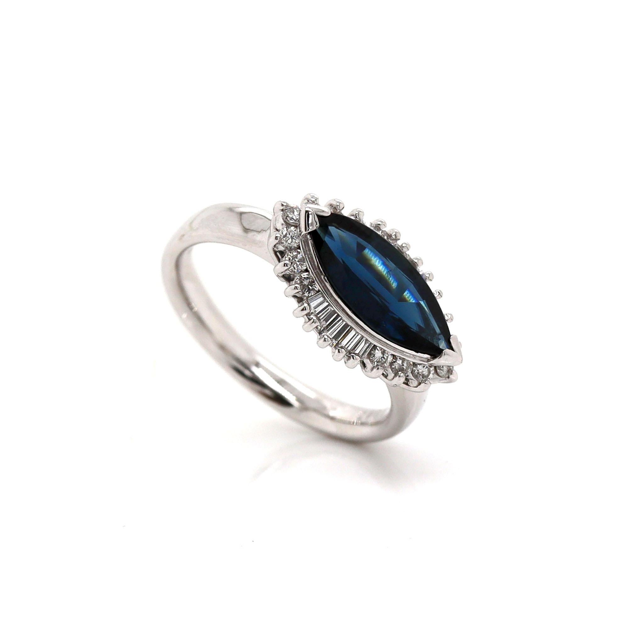 Platinum Pt900 Sapphire & Diamond Ring

This stunning platinum ring features a breathtaking marquise-shaped sapphire, set in an elegant east-west orientation, creating a modern yet timeless statement piece. The sapphire, with its deep, rich hue, is
