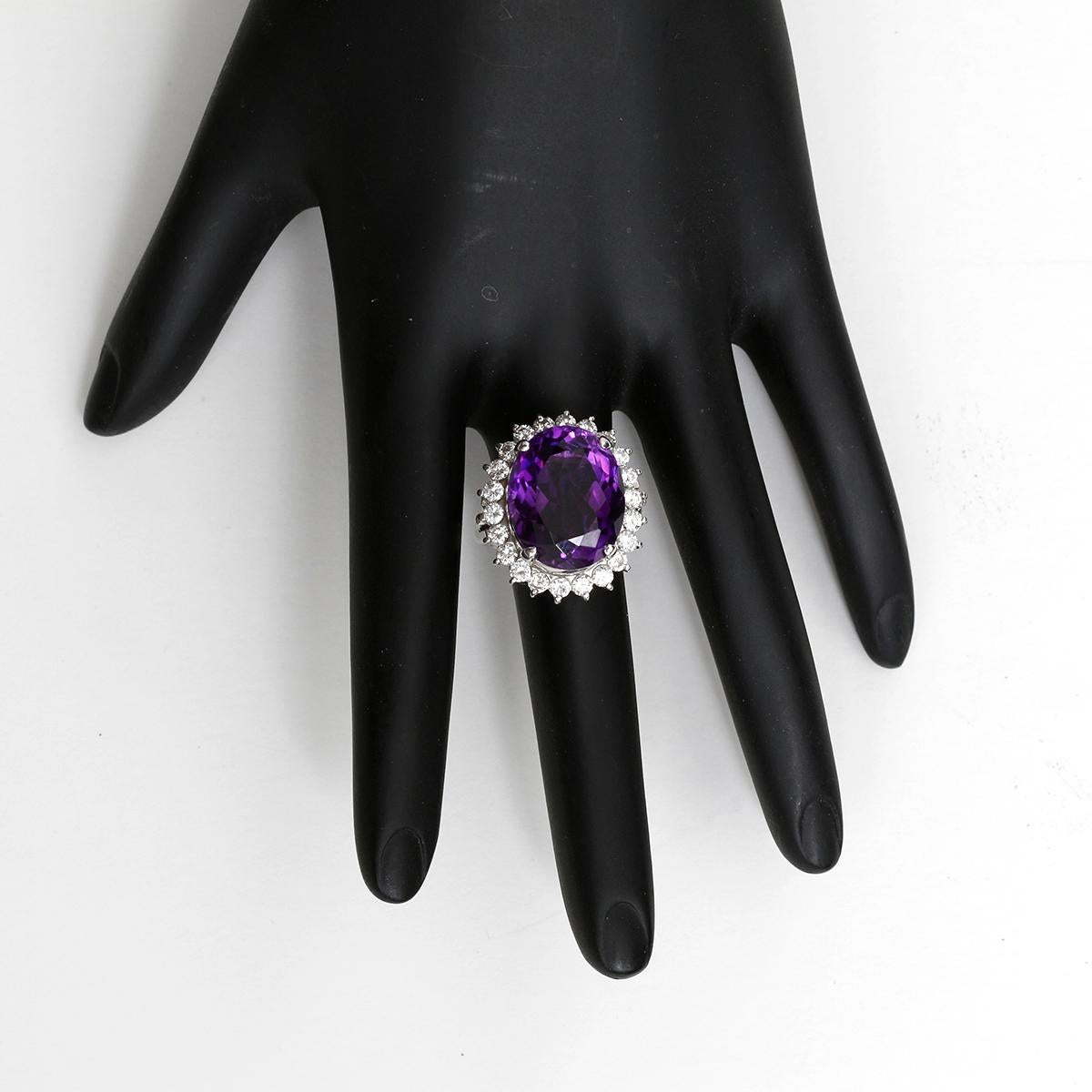 Platinum Purple Amethyst and Diamond Ring  - Dazzling platinum ring with oval amethyst measuring 16.85x13.63x9.21 mm and weighs approx 11.89 cts. The Purple gem is surrounded by full-cut diamonds weighing approx 1.37 cts. Total weight is 16 grams