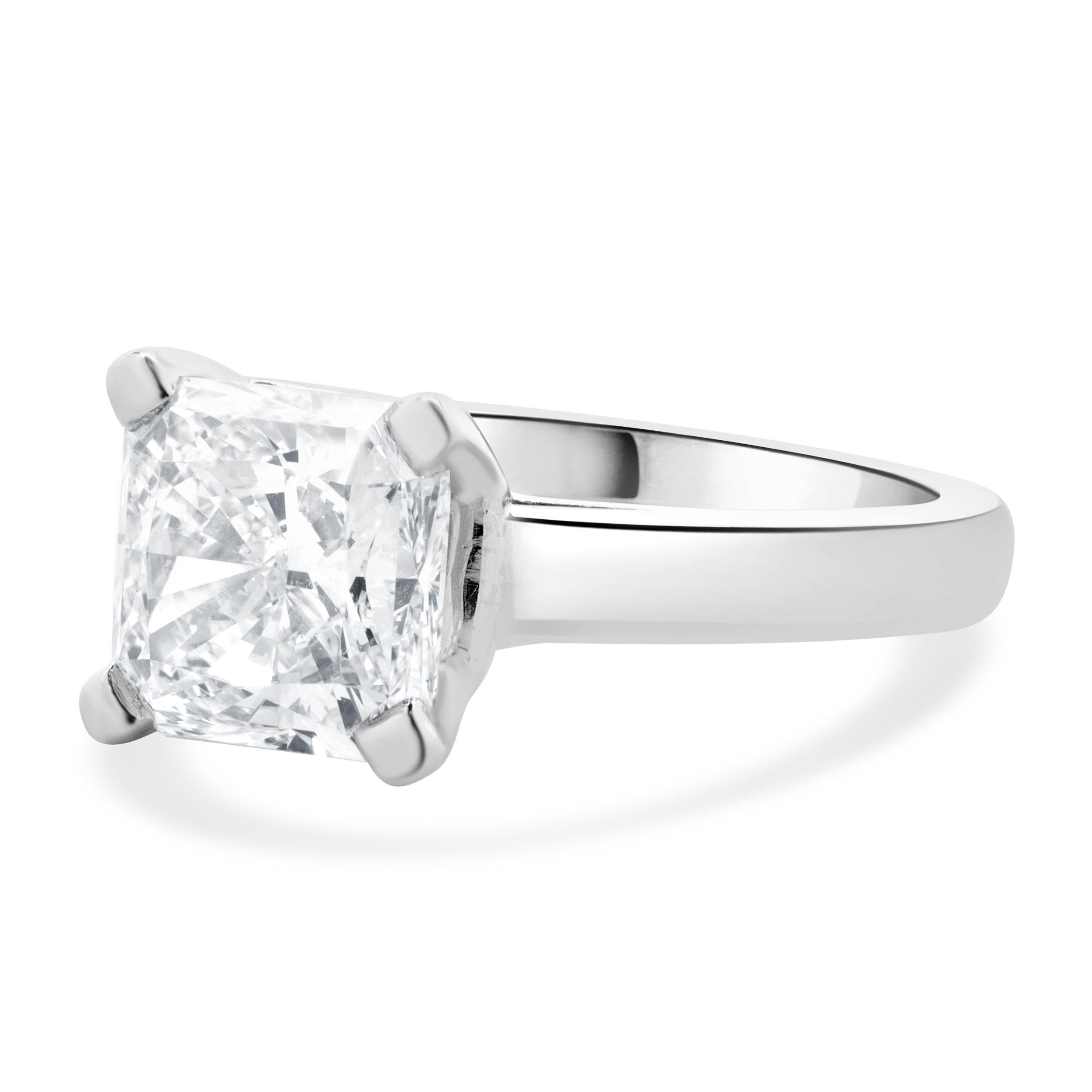 Designer: custom
Material: platinum
Diamond: 1 radiant cut = 3.24ct
Color: J
Clarity: SI1
EGL: 2961205833
Dimensions: ring top measures 9mm wide
Ring Size: 6.75 (complimentary sizing available)
Weight: 9.45 grams
