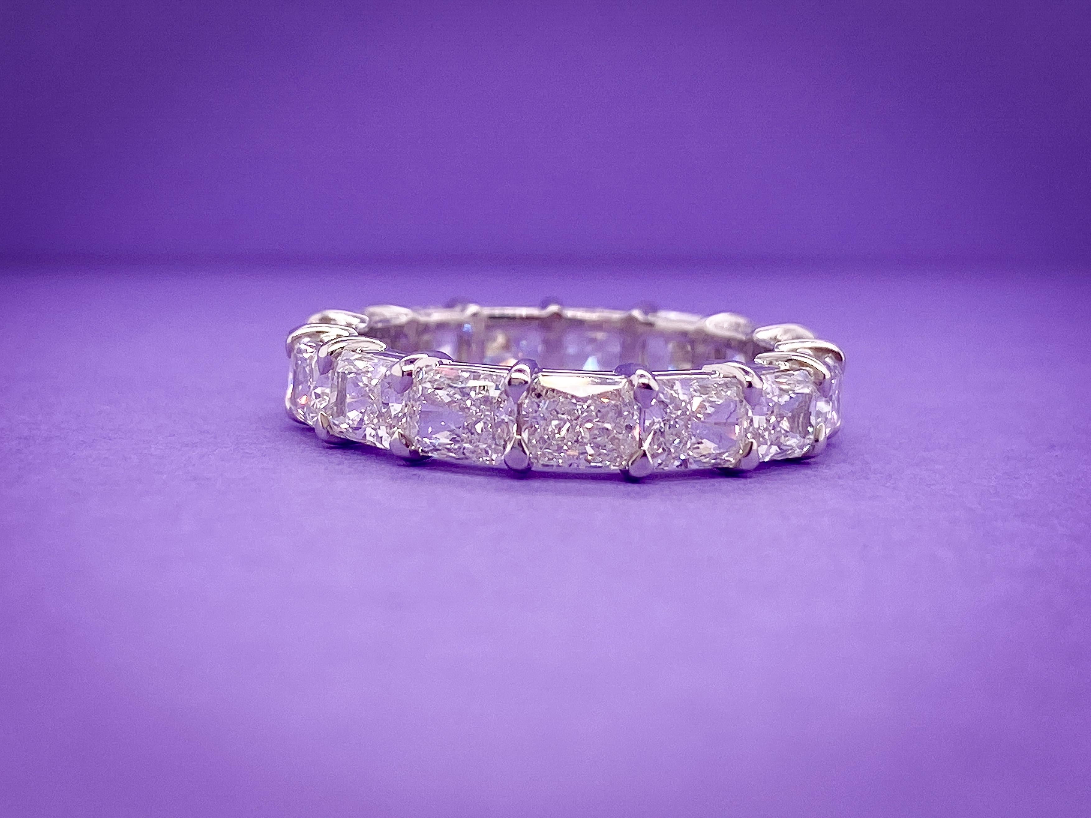 It's a sparkle with a twist! This Radiant Horizontal Eternity Band features 15 Radiant Diamonds, with a total weight of 4.59 Carats. The stones are G-H Color and VS Clarity and are set Horizontal for a fun and unique twist. The ring is set in