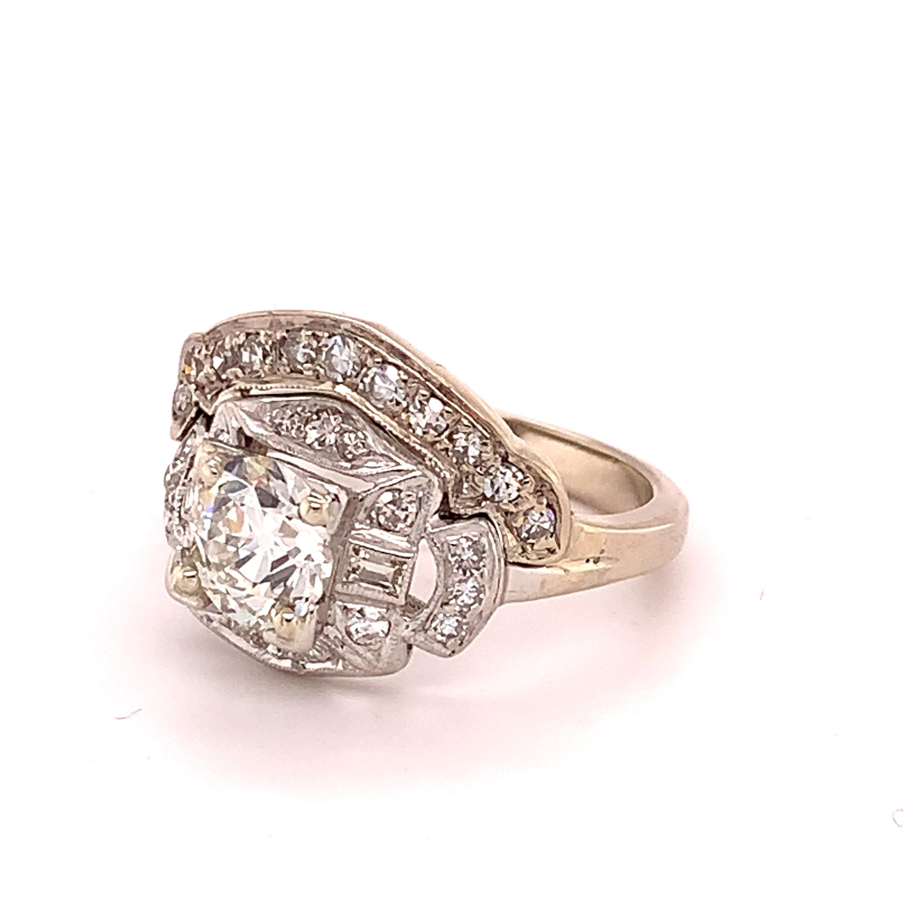 Platinum Ring 1.05ct Center European Genuine Natural Diamond (#J4888)

Vintage platinum diamond wedding set with attached band featuring a white European cut diamond weighing 1.05 carats. The diamond is I color SI2 clarity and measures exactly