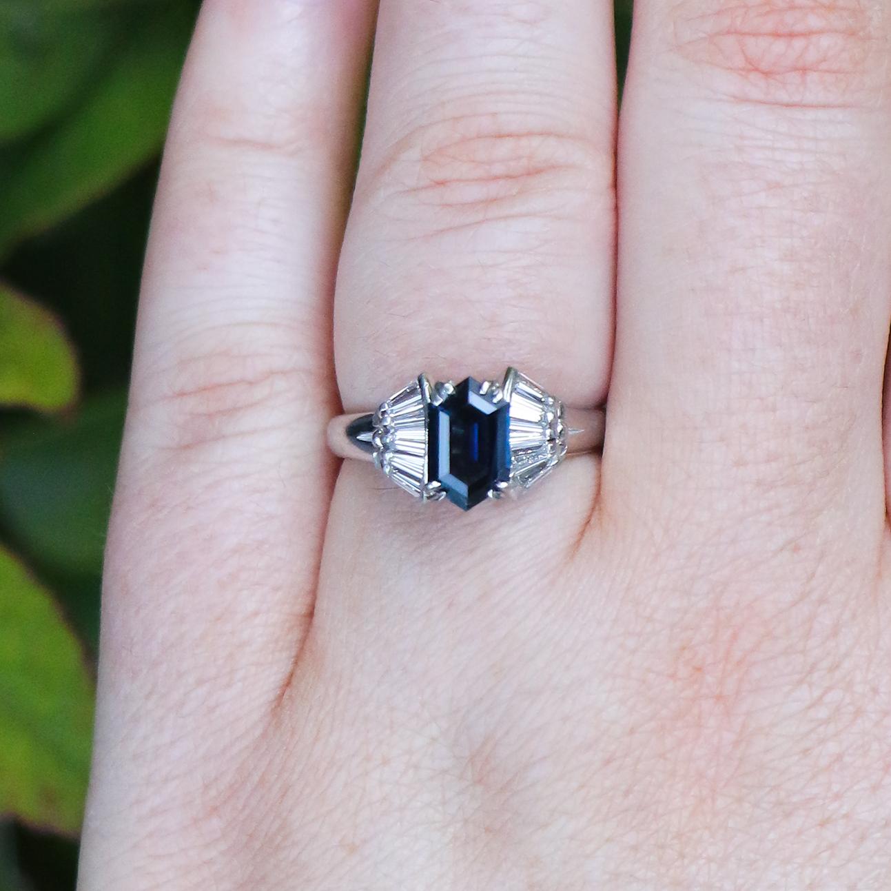 This ring displays a beautiful 1.40 carat Montana sapphire flanked by diamonds, the prongs hold the stone in place with minimal interruption. Its platinum band aids its uniqueness and rarity making this piece a statement for all that wear it.

•