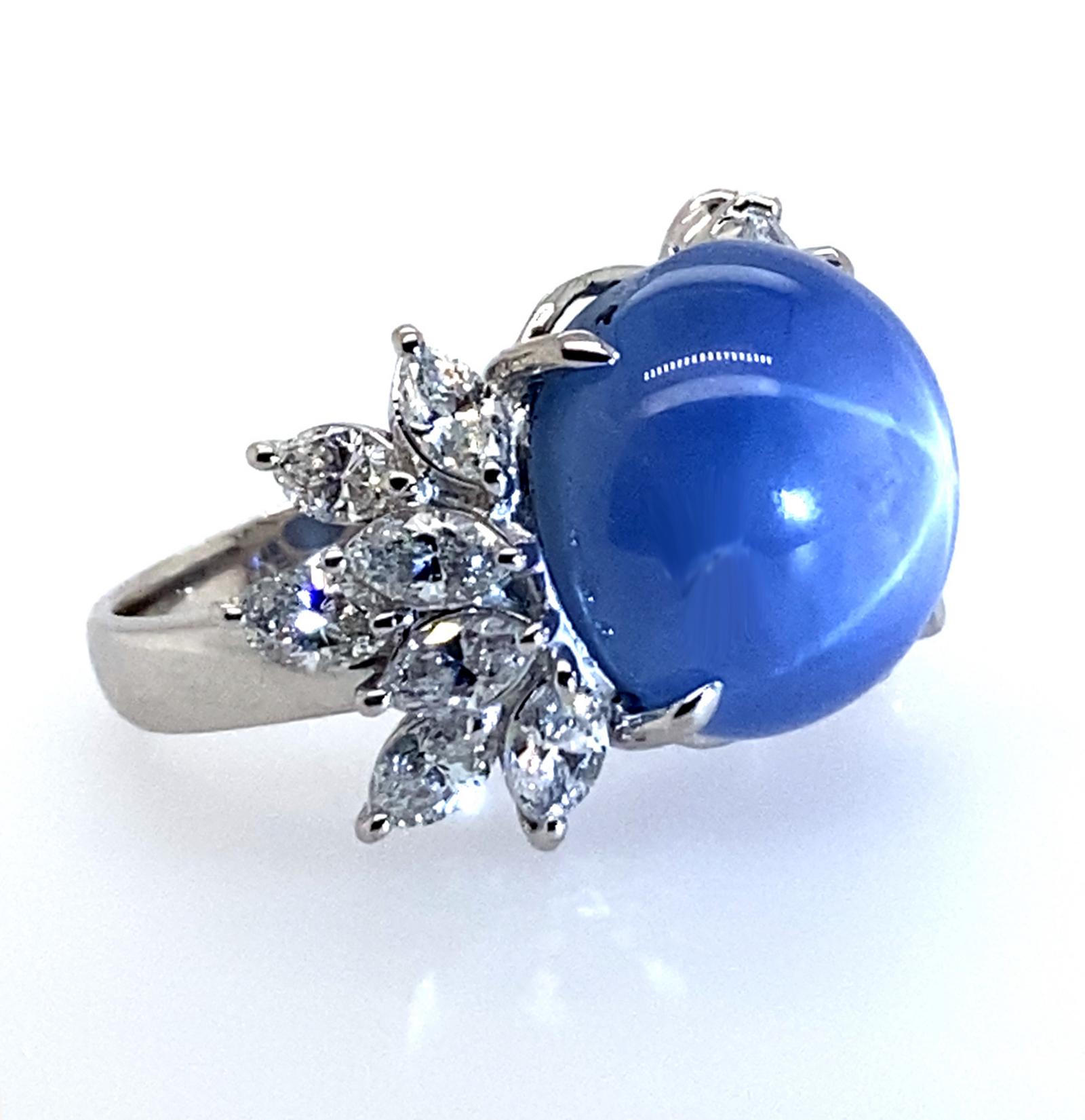 Platinum Ring with 21.83 carat Sky Blue Star Sapphire and 14 marquis cut diamonds weighing 2.03 carats. Complimentary expert ring sizing included with your purchase.