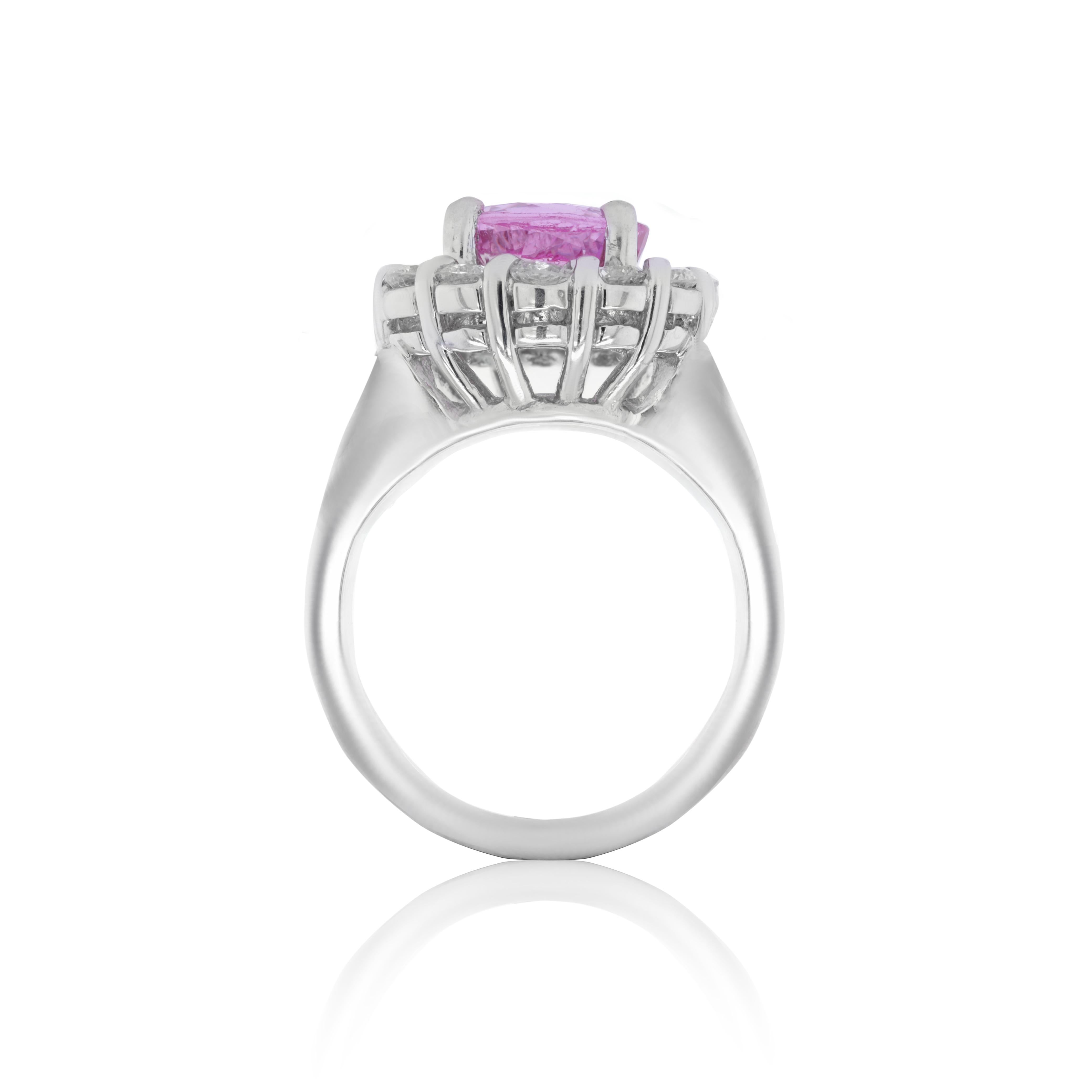 Platinum sapphire ring with center round 2.24 pink sapphire surrounded by round diamonds (1.20ct) 
