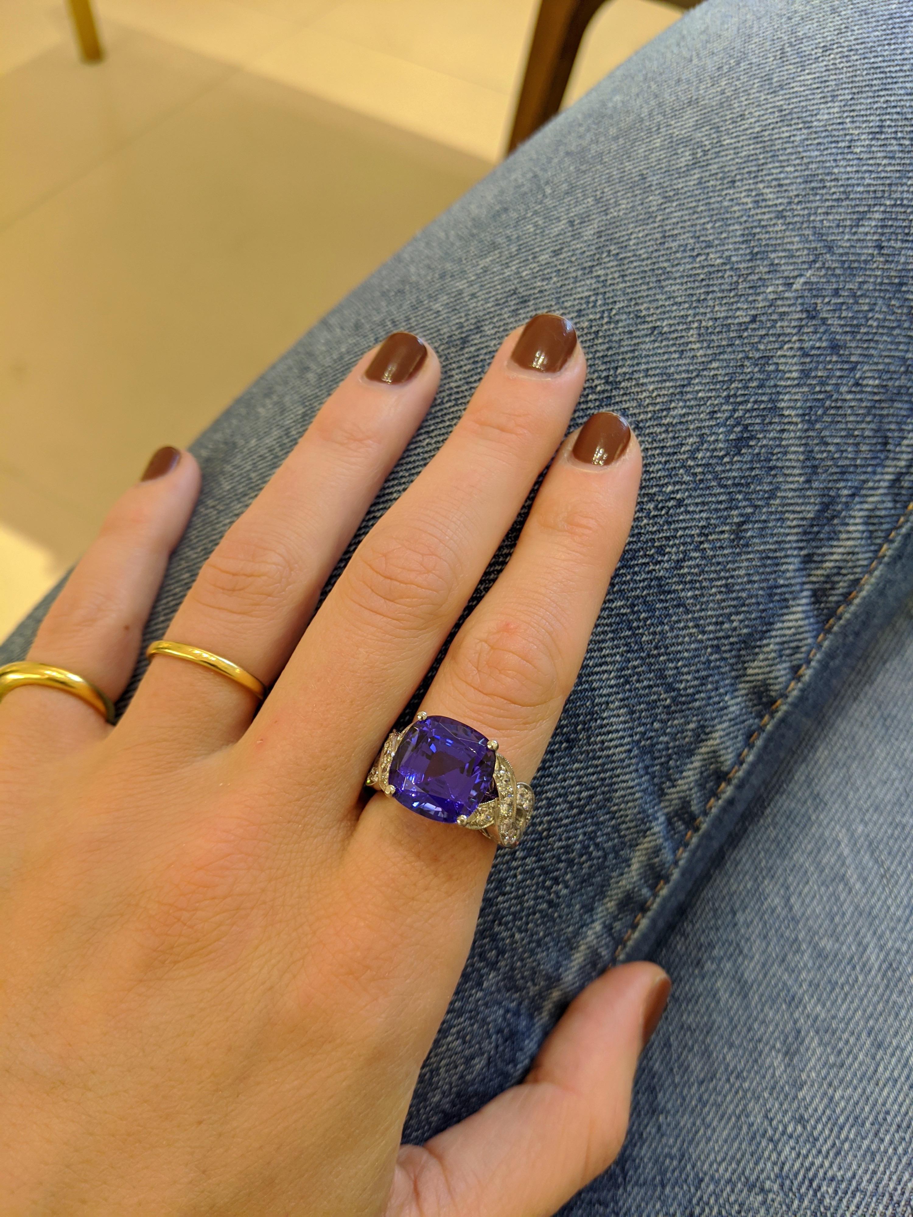 This one of a kind piece created by Cellini Jewelers NYC, features a handmade Platinum setting which surrounds an intense cushion cut Tanzanite. This very vibrant stone is set in a four prong setting with Diamond braiding down the sides .
Finger