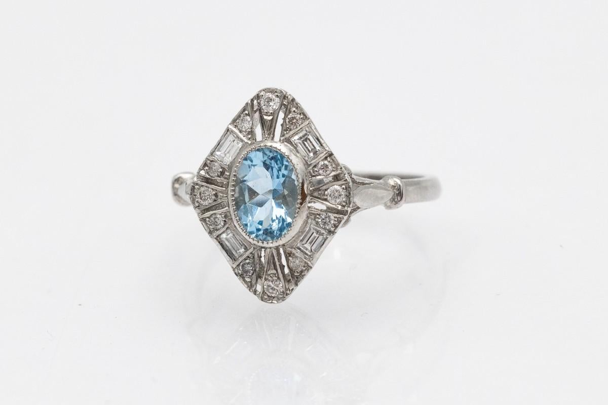 Oval Cut Platinum ring with aquamarine and diamonds