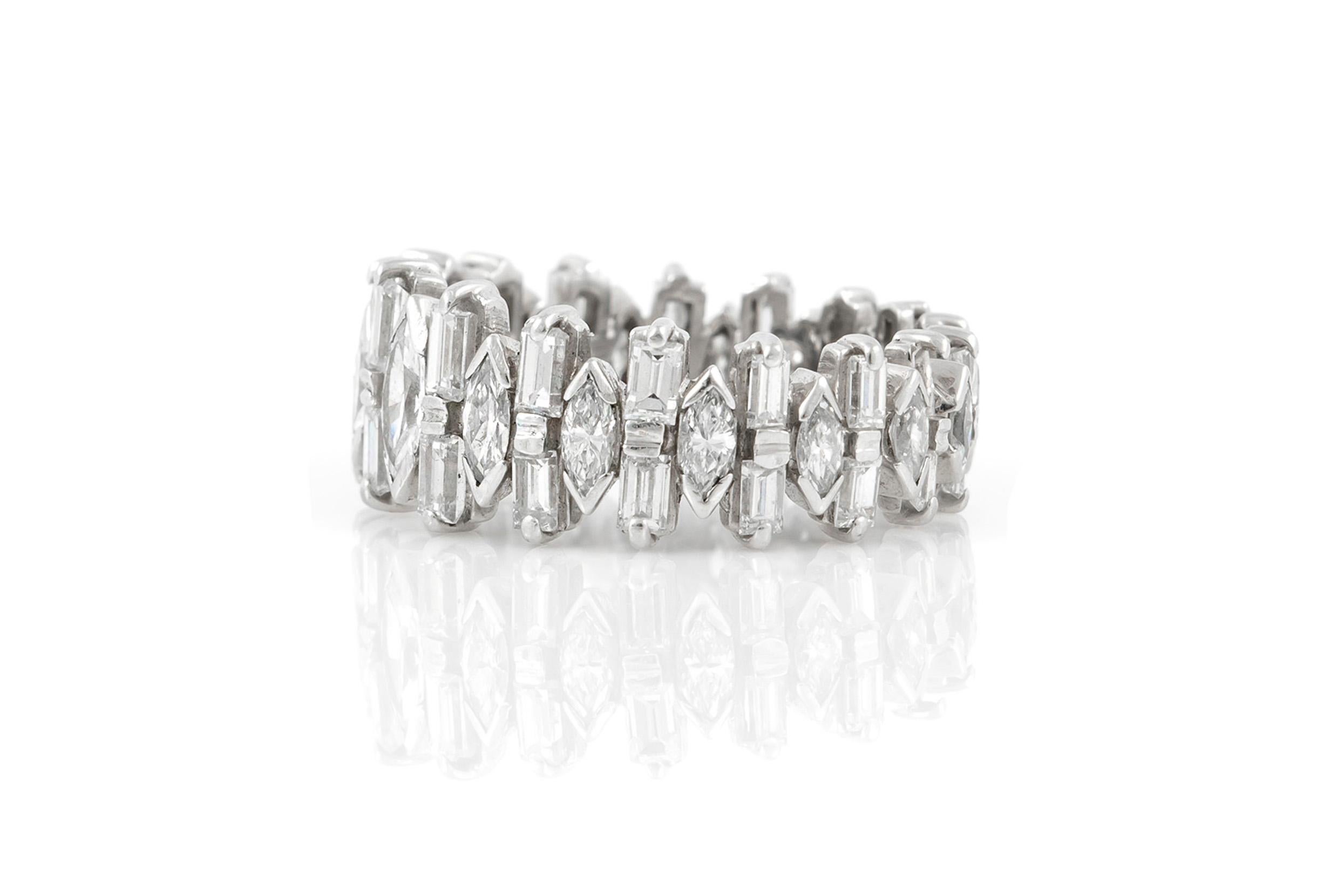 Finely crafted Platinum ring with Baguette-cut Diamonds weighing approximately 2.00 carats and Marquise-cut Diamonds weighing approximately 3.00 carats. 