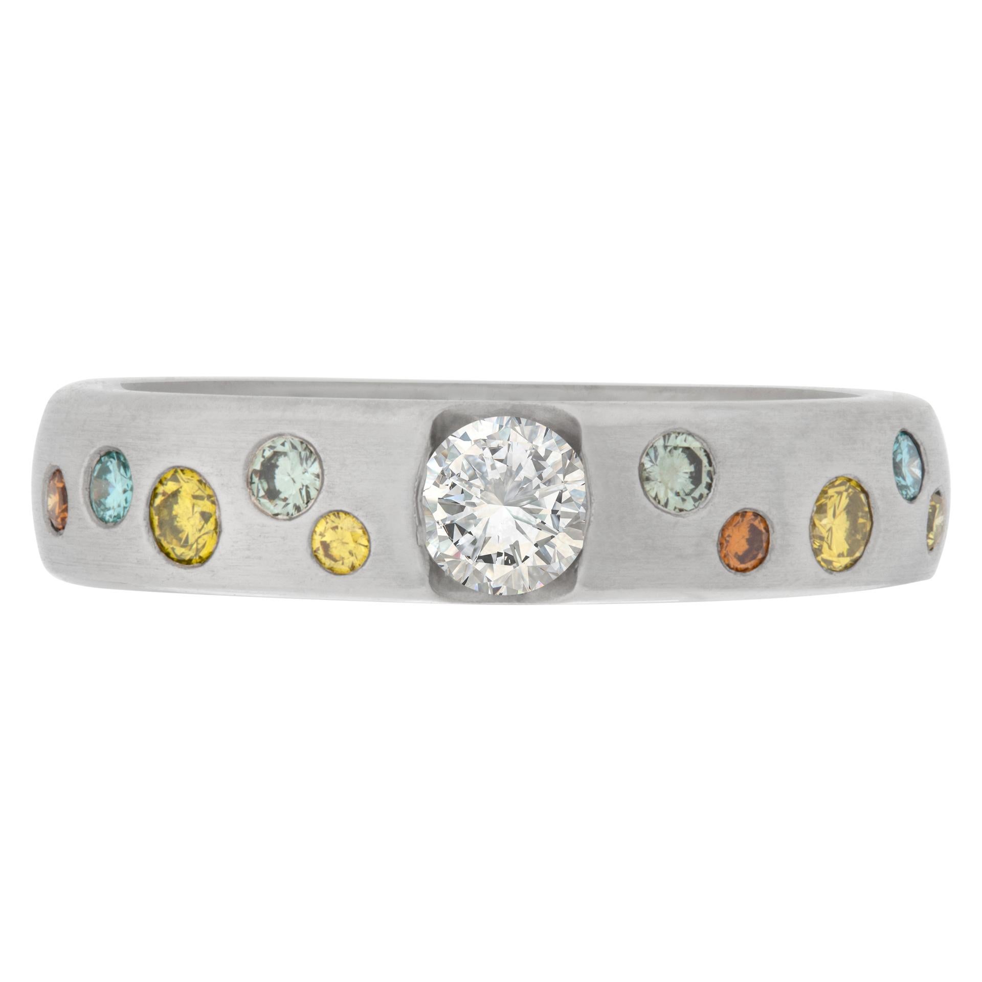 Platinum ring with center diamond and bezel set 