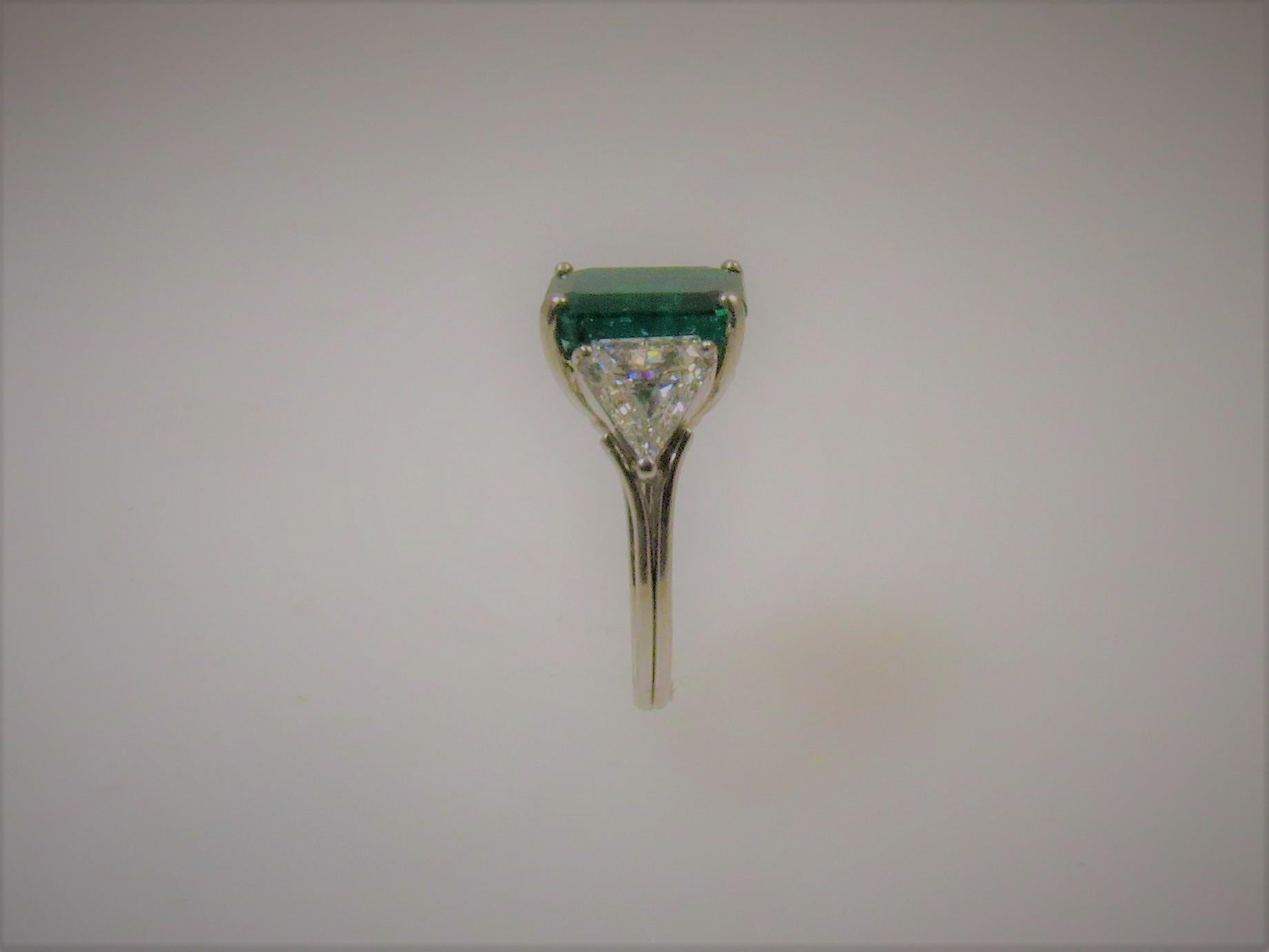 Women's Emerald Cut Emerald and Triangular Diamond Platinum Ring For Sale