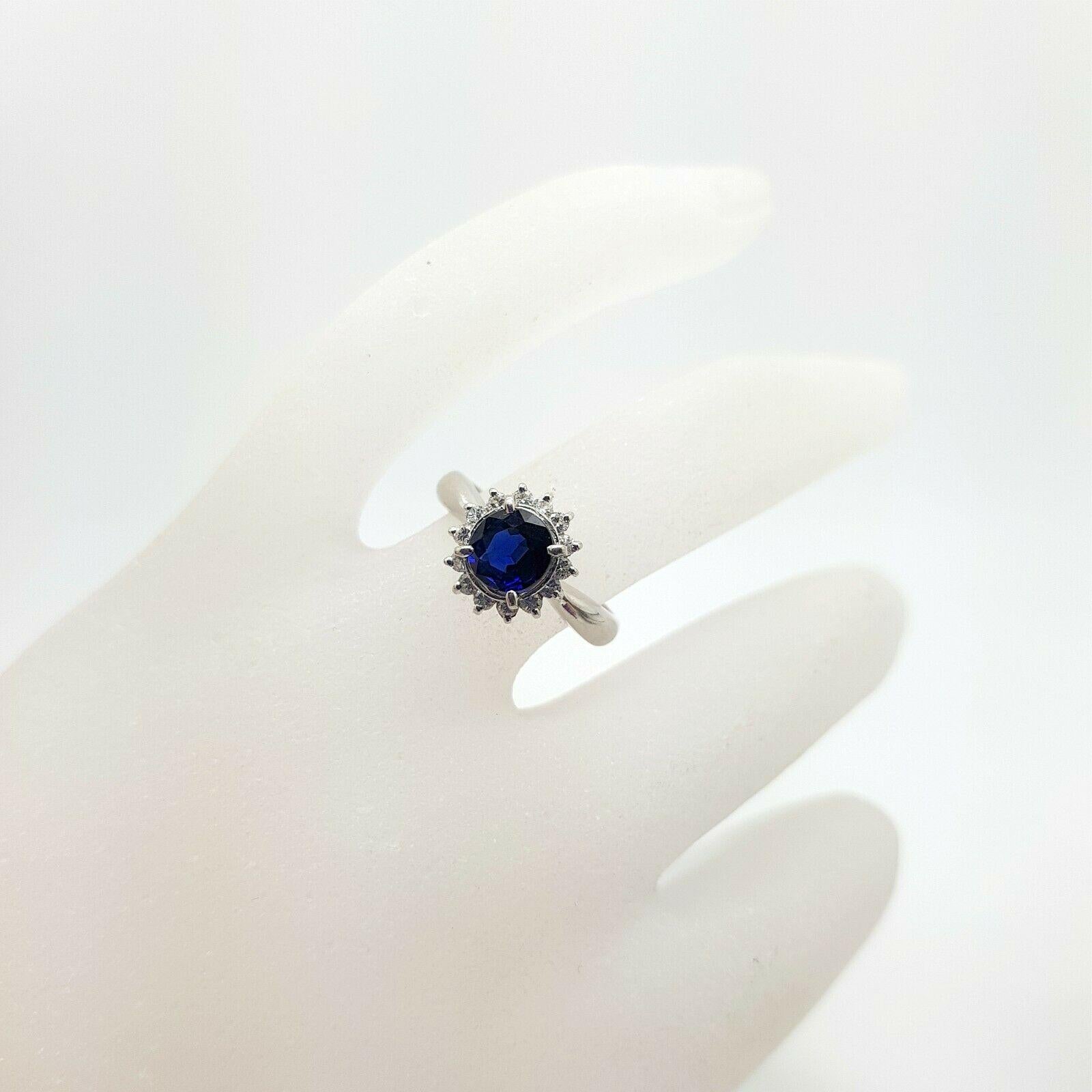 Round Cut Platinum Ring with Nice Intense Blue Sapphire and Diamonds